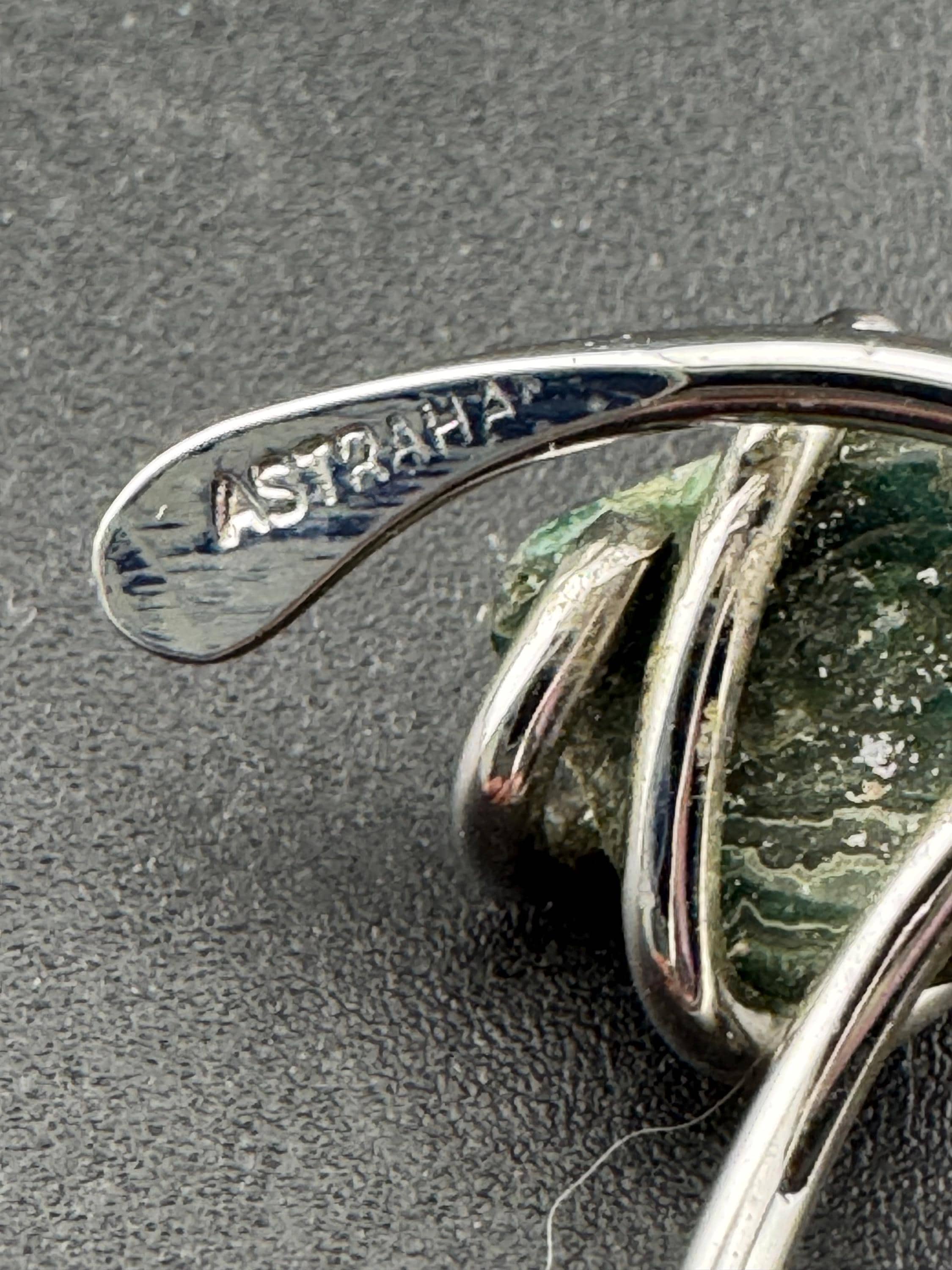 1970s vintage signed ASTRAHA modernist silver tone adjustable ring with central green gemstone