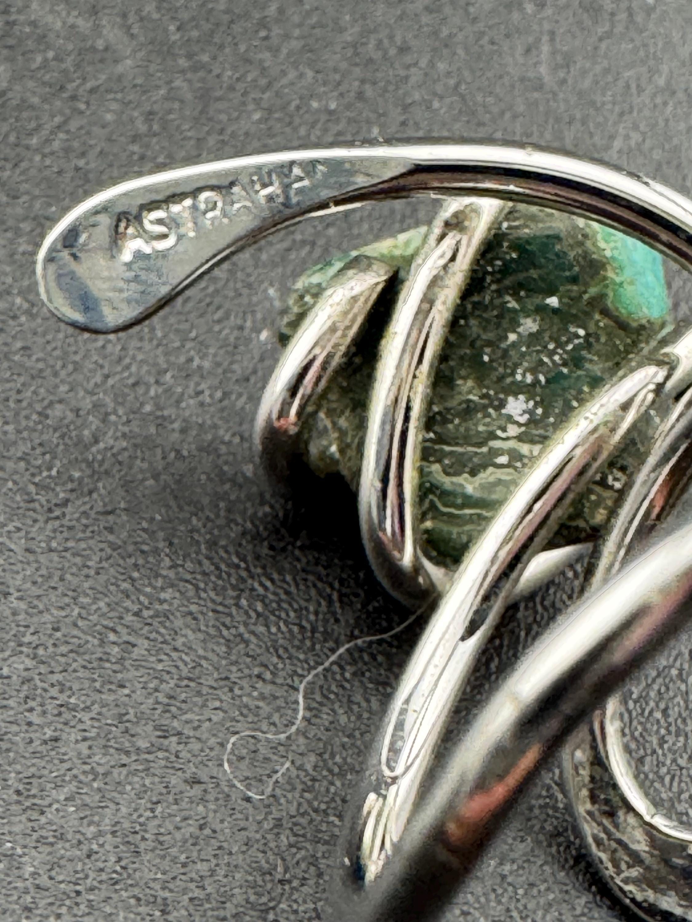 1970s vintage signed ASTRAHA modernist silver tone adjustable ring with central green gemstone