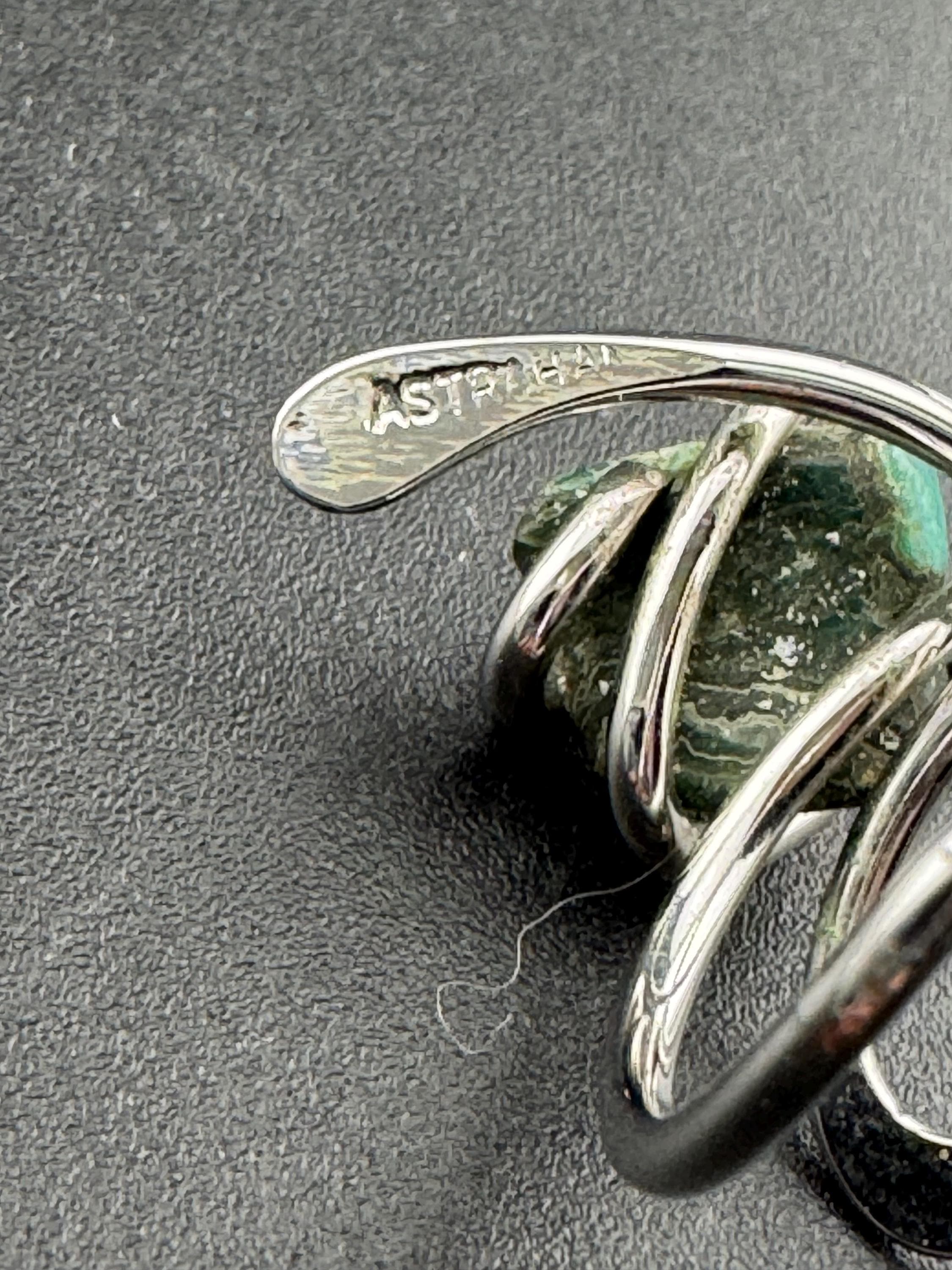 1970s vintage signed ASTRAHA modernist silver tone adjustable ring with central green gemstone