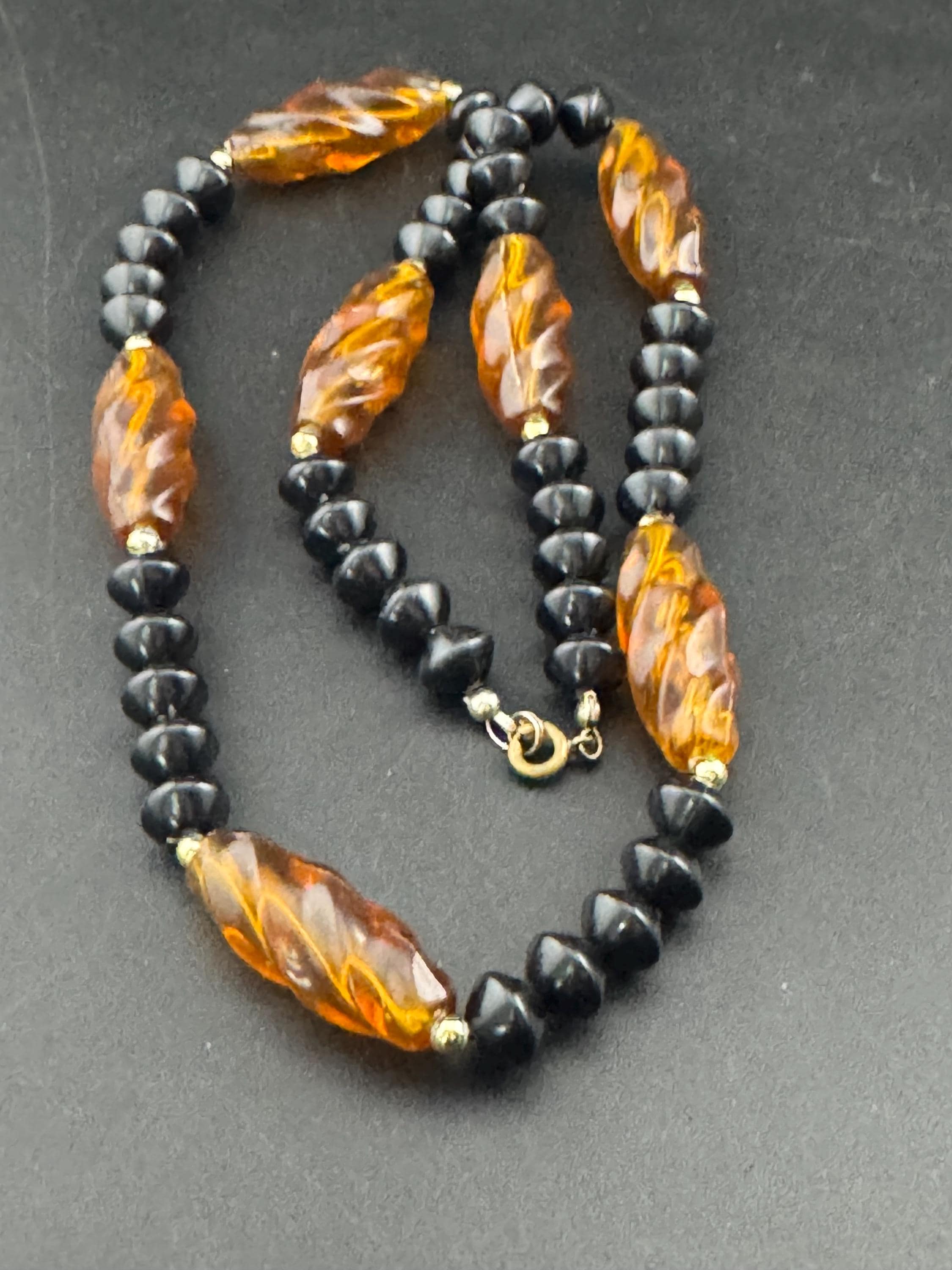 Long faux amber brown plastic beaded necklace with black beads 70s early 80s , 63cm