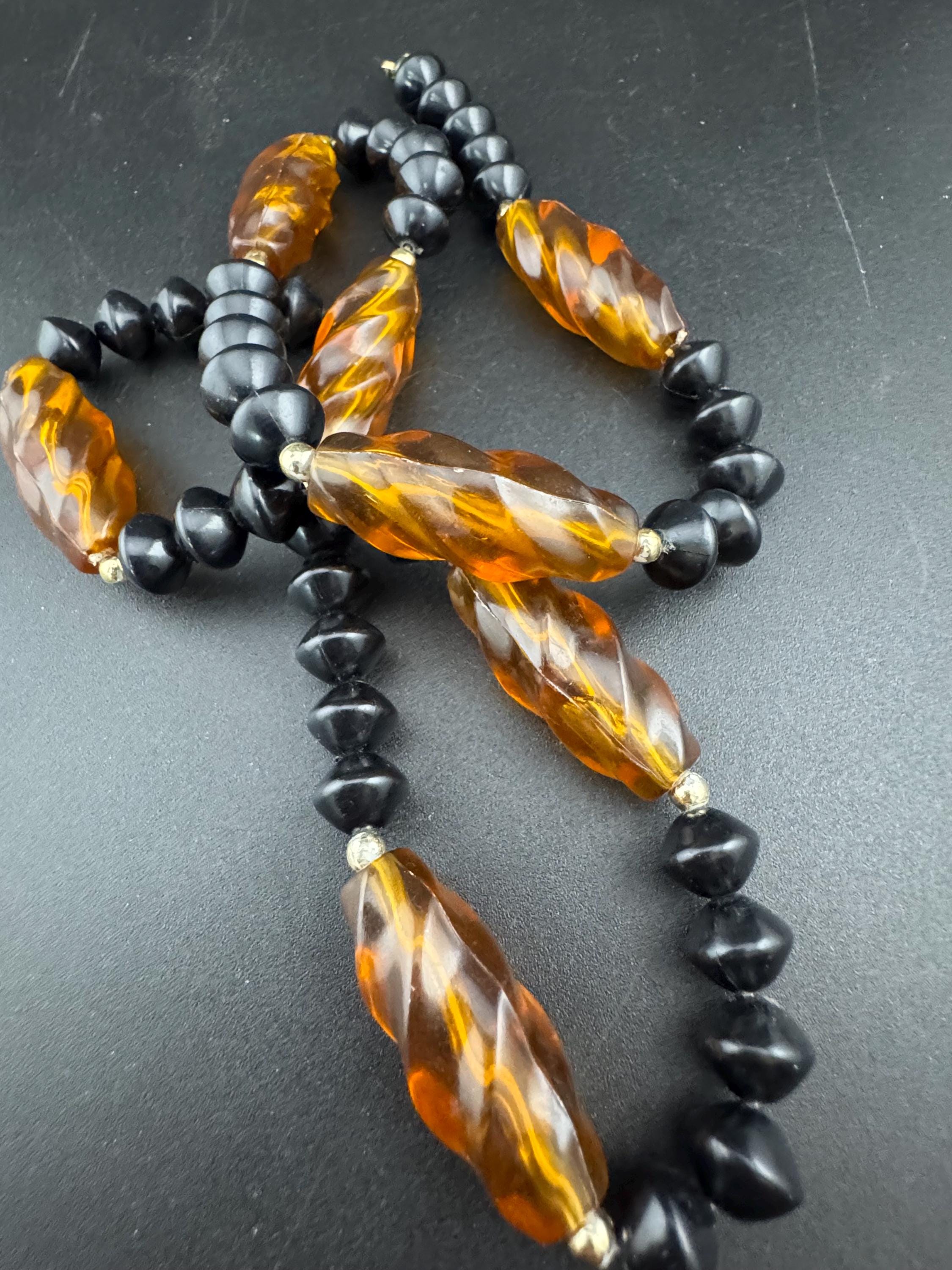 Long faux amber brown plastic beaded necklace with black beads 70s early 80s , 63cm