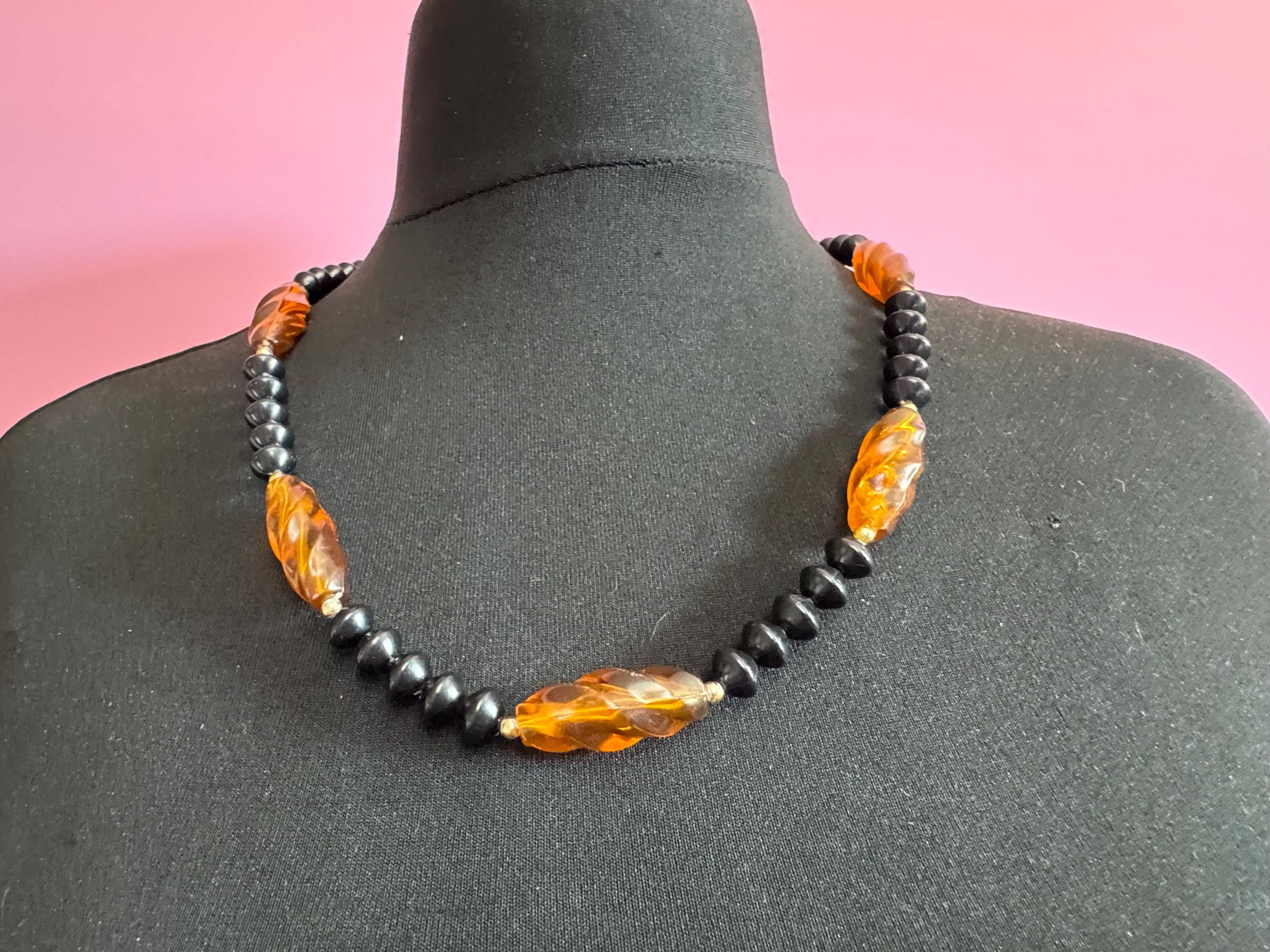 Long faux amber brown plastic beaded necklace with black beads 70s early 80s , 63cm