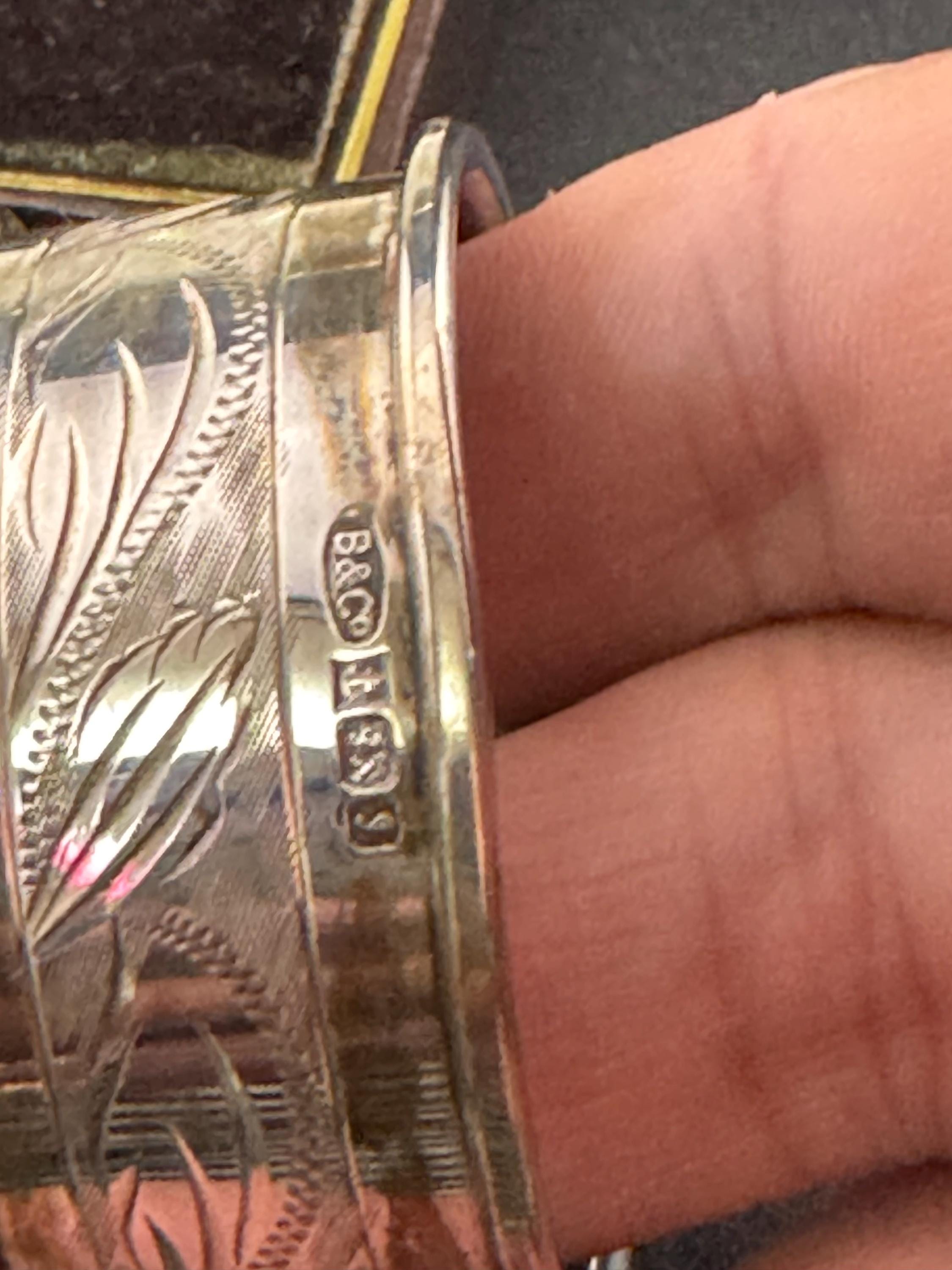 925 sterling silver napkin ring with a black cartouche for monogramming in a presentation box