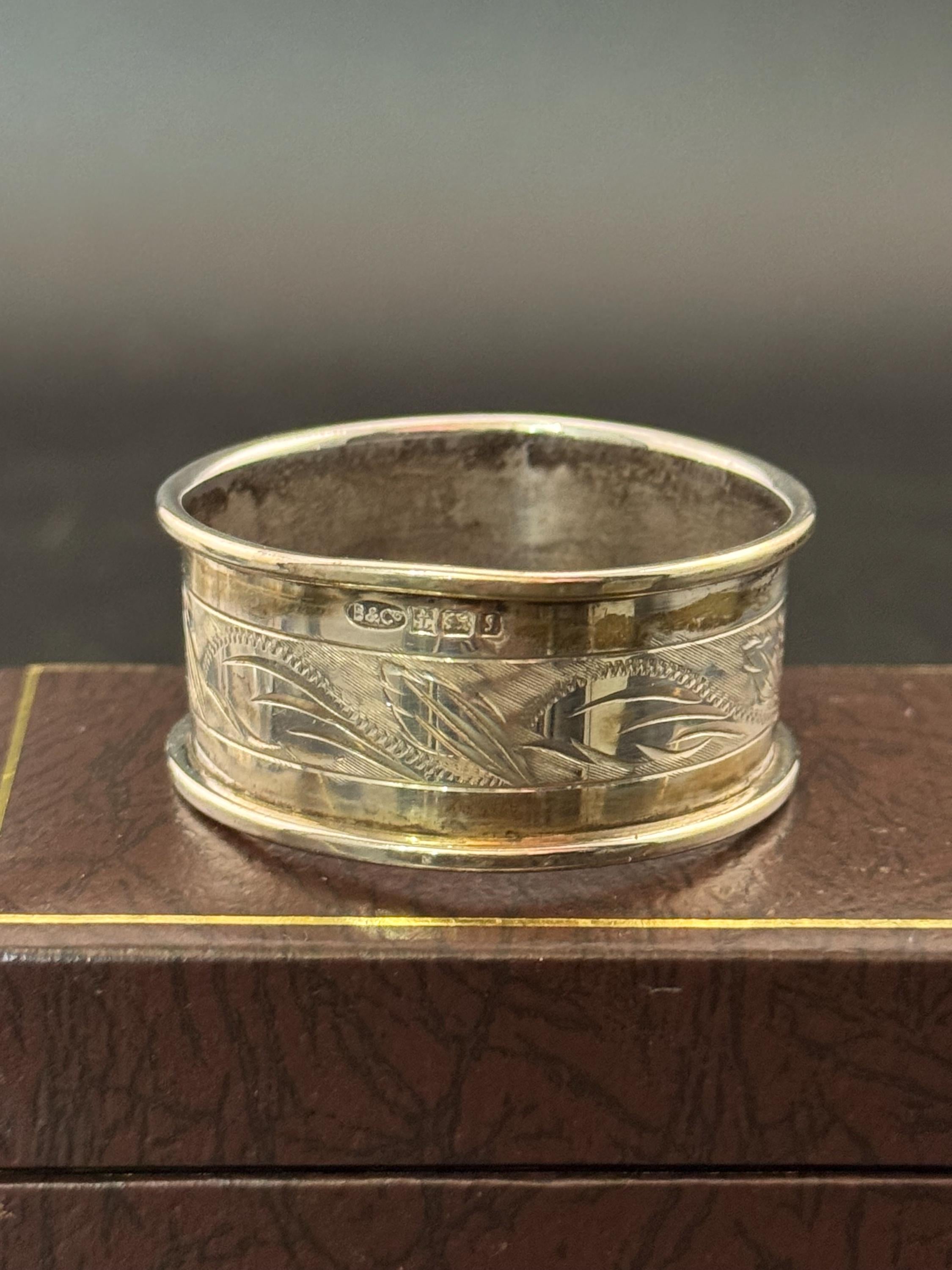 925 sterling silver napkin ring with a black cartouche for monogramming in a presentation box