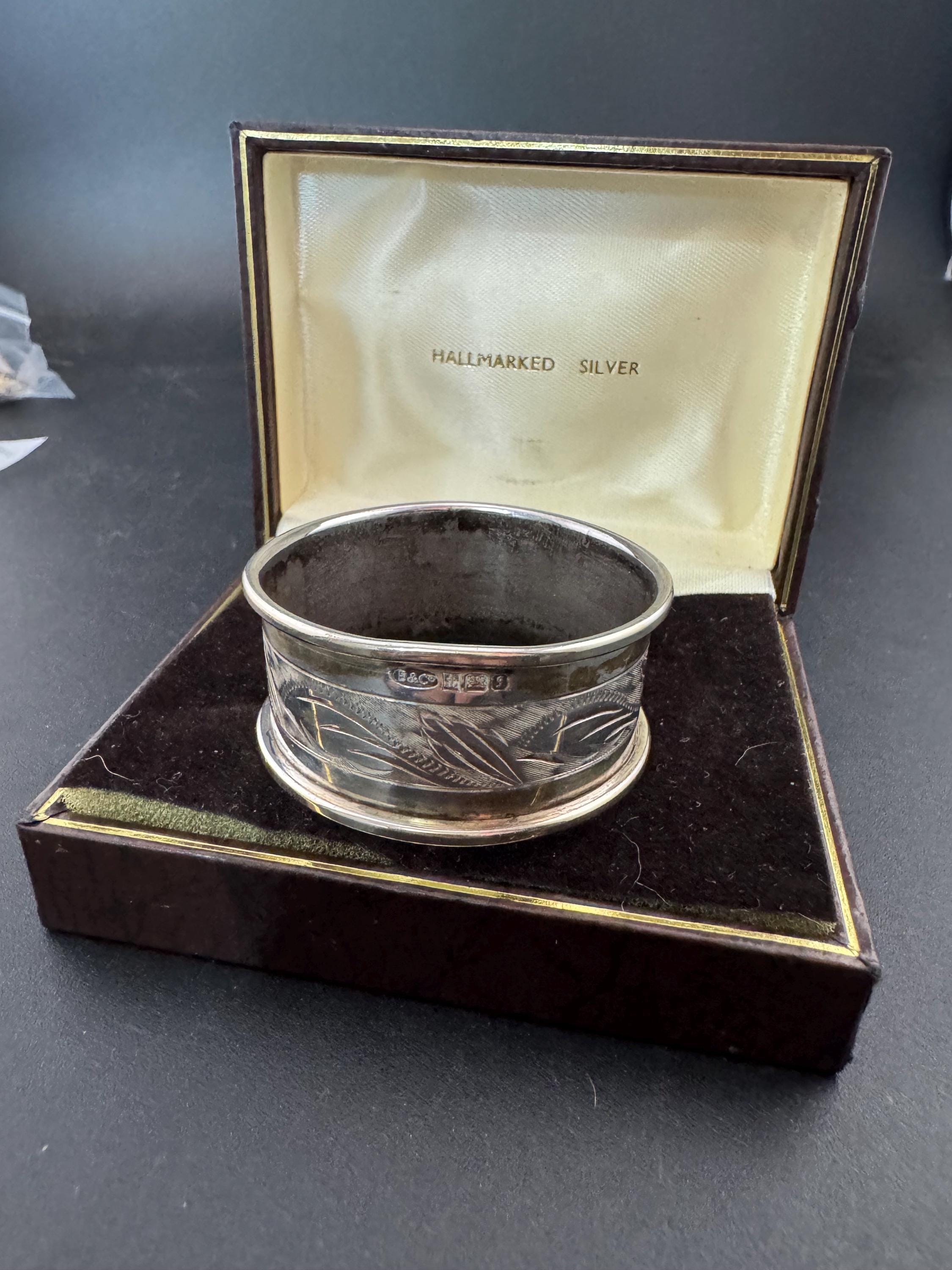 925 sterling silver napkin ring with a black cartouche for monogramming in a presentation box