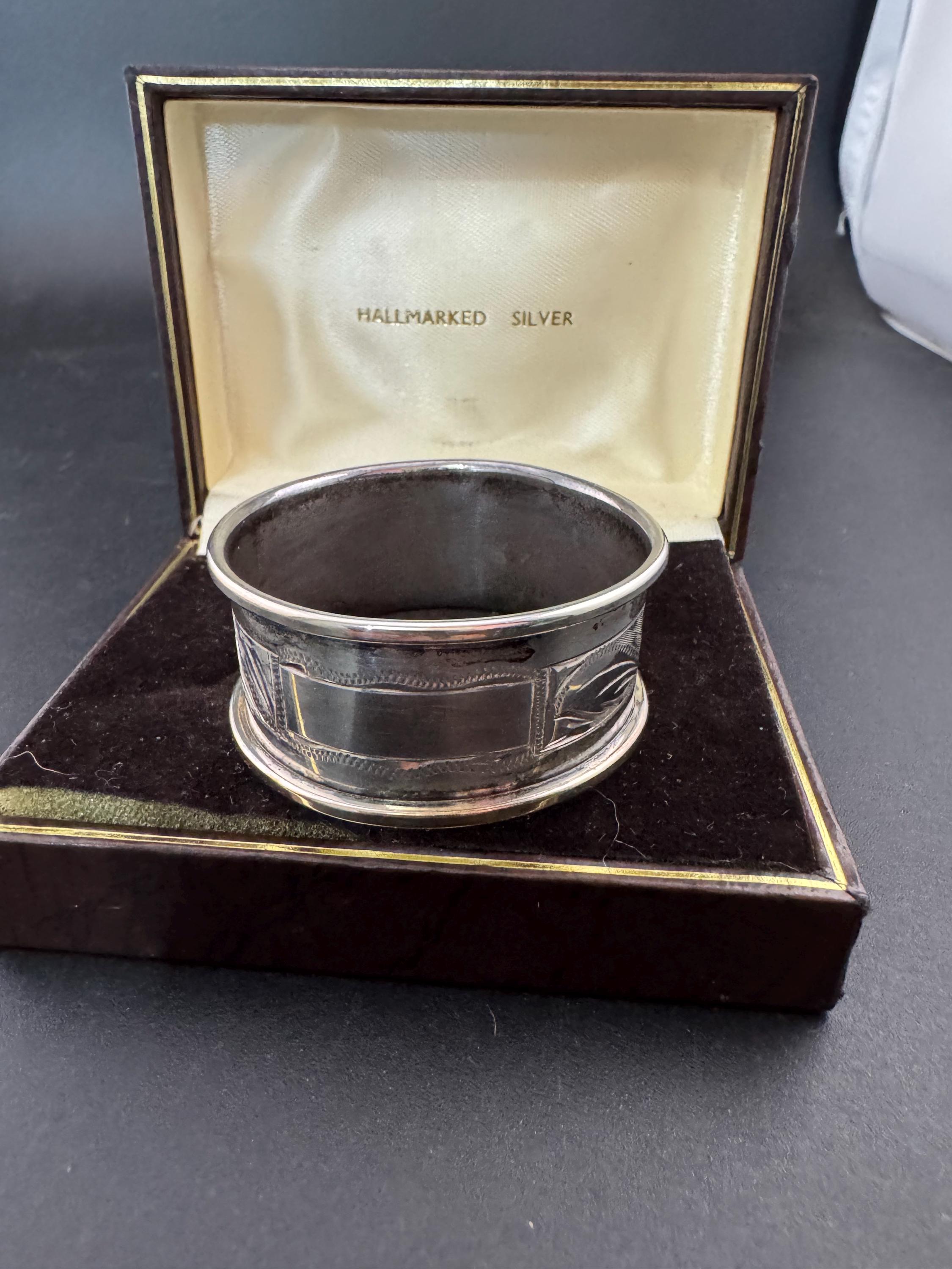 925 sterling silver napkin ring with a black cartouche for monogramming in a presentation box
