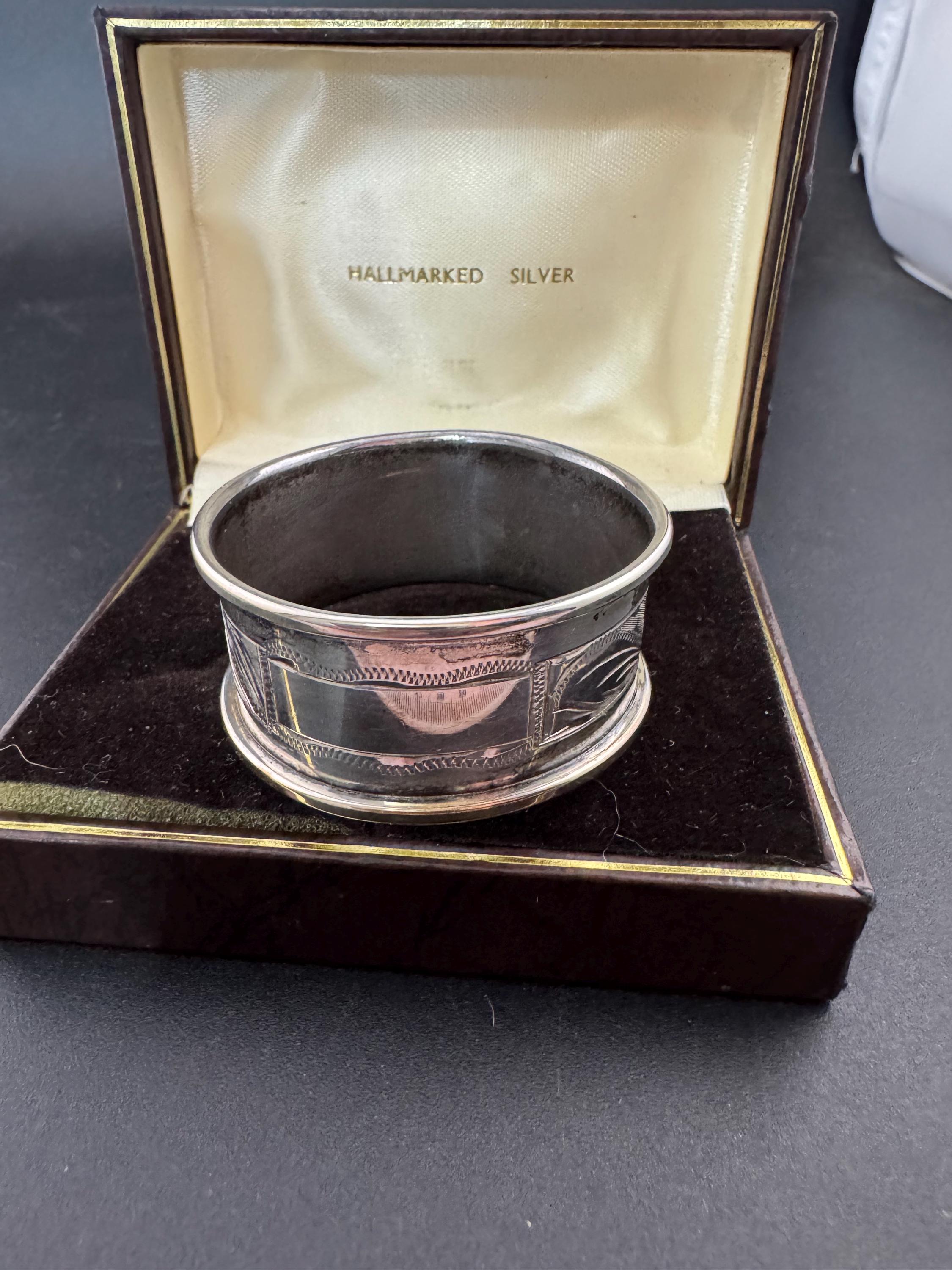 925 sterling silver napkin ring with a black cartouche for monogramming in a presentation box