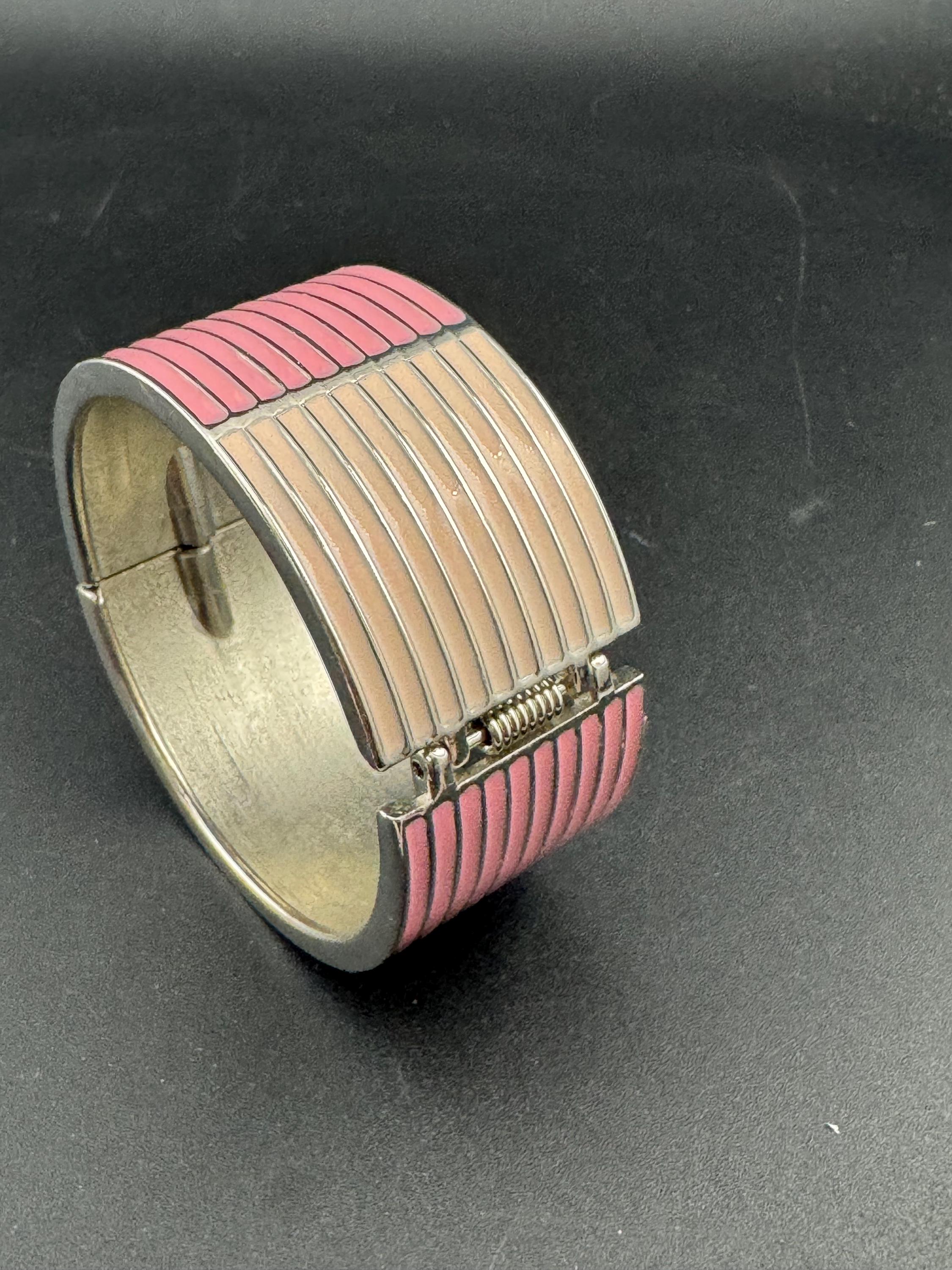 Vintage wide silver tone hinged pink enamel clamper bangle bracelet
