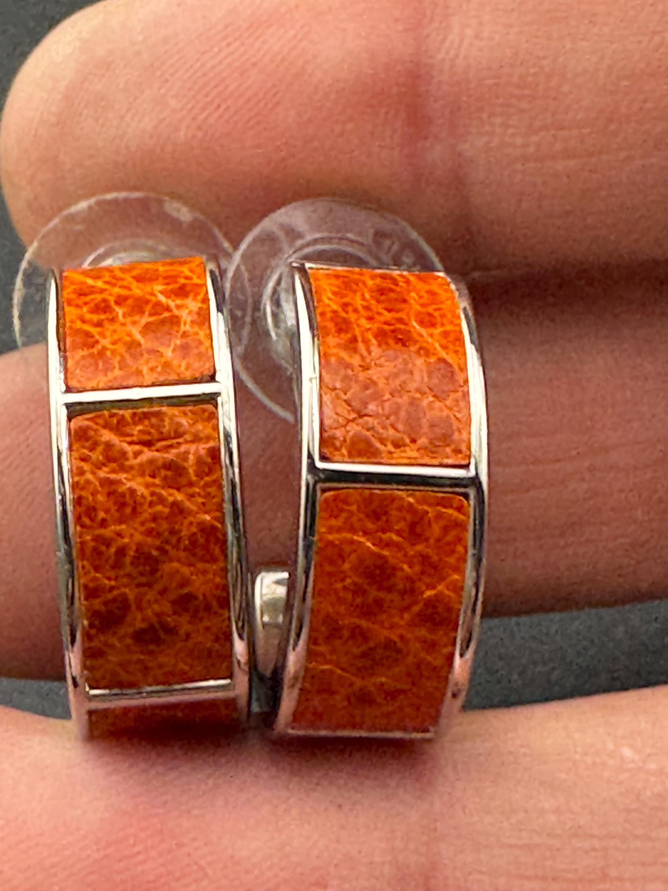 Retro silver tone wide bright orange animal print  hoop pierced earrings