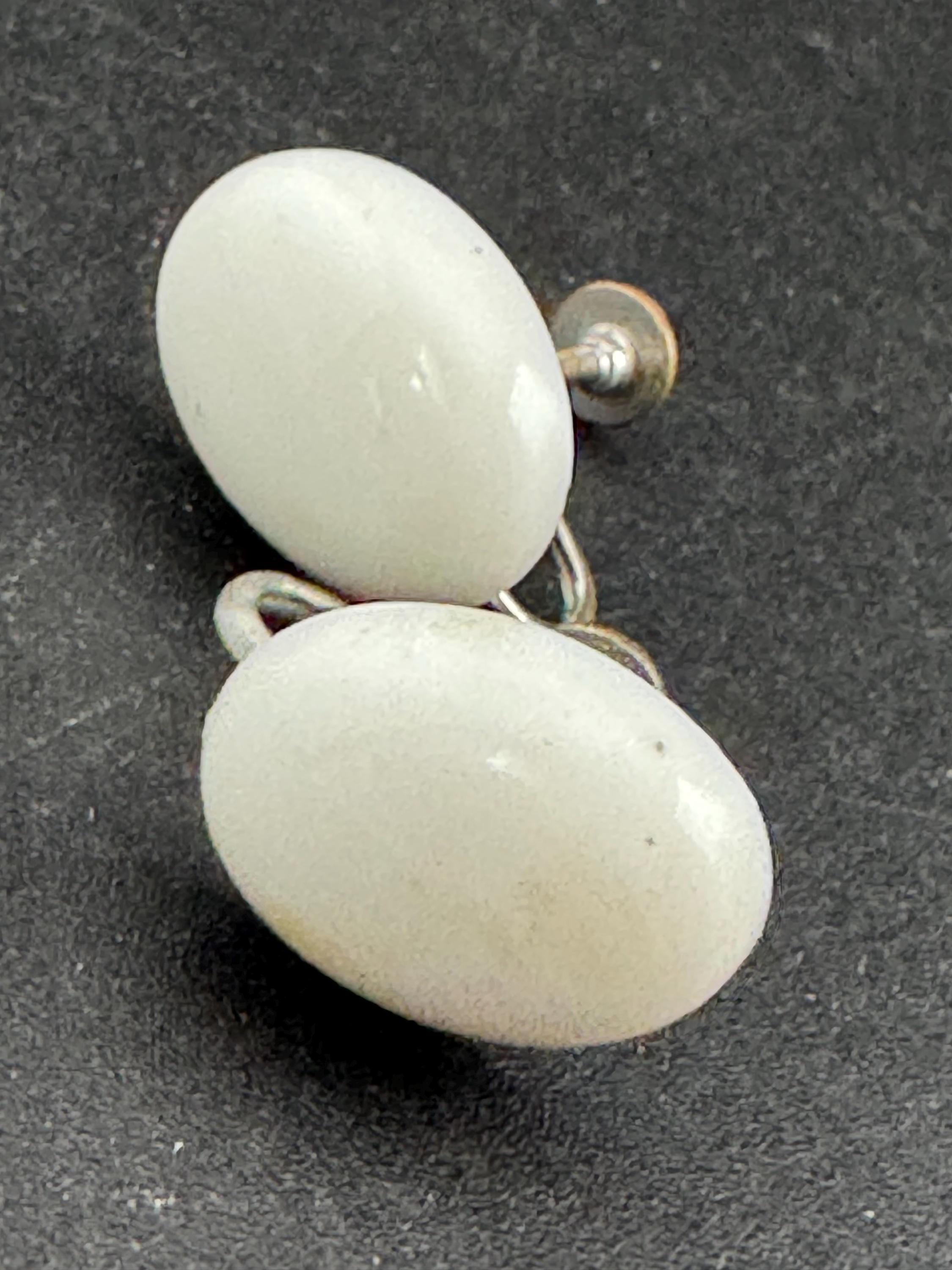 Vintage early plastic white oval screw back clip on earrings art deco