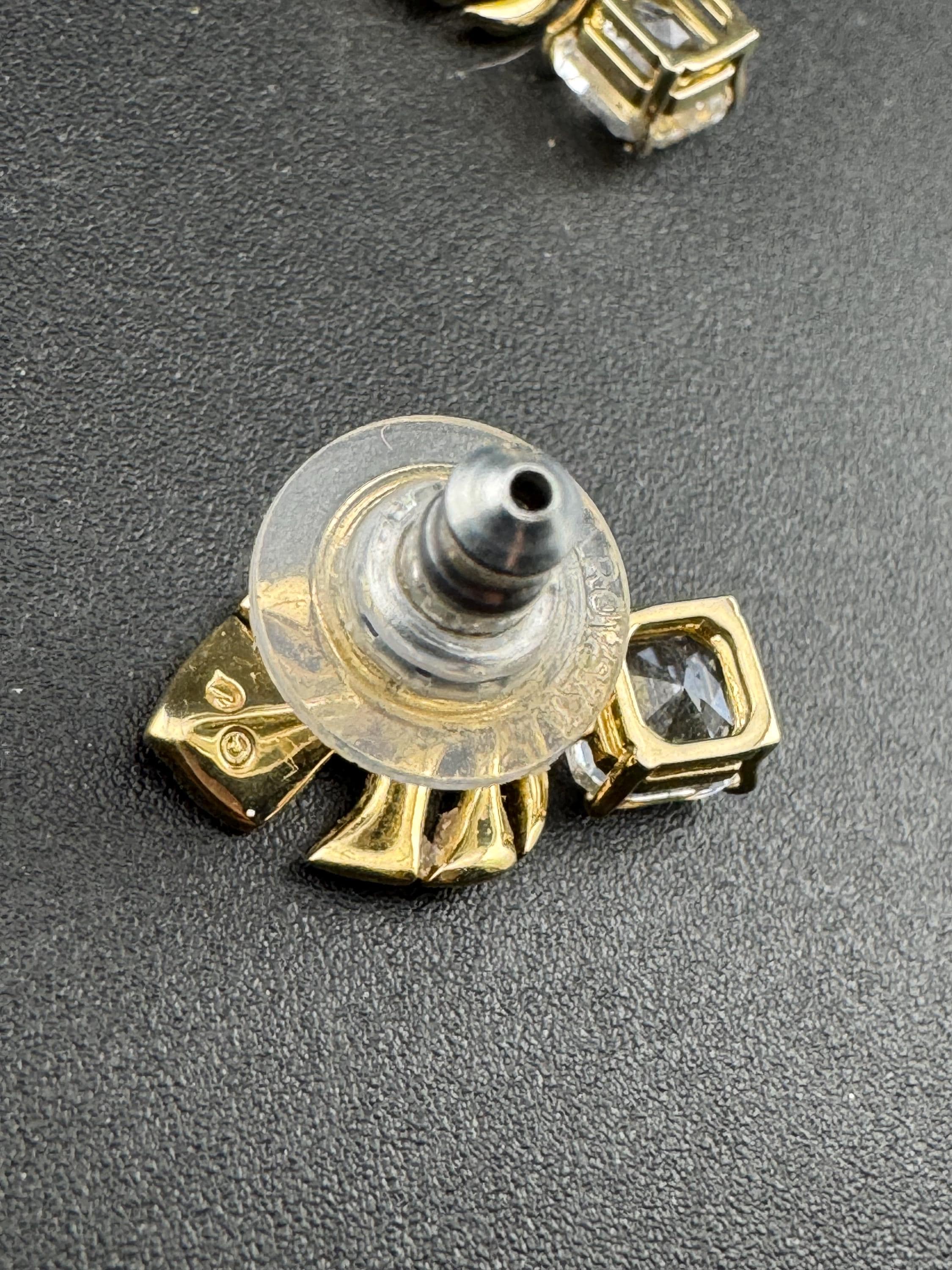 Signed Swarovski gold plated small clear crystal palm leaf pierced drop earrings