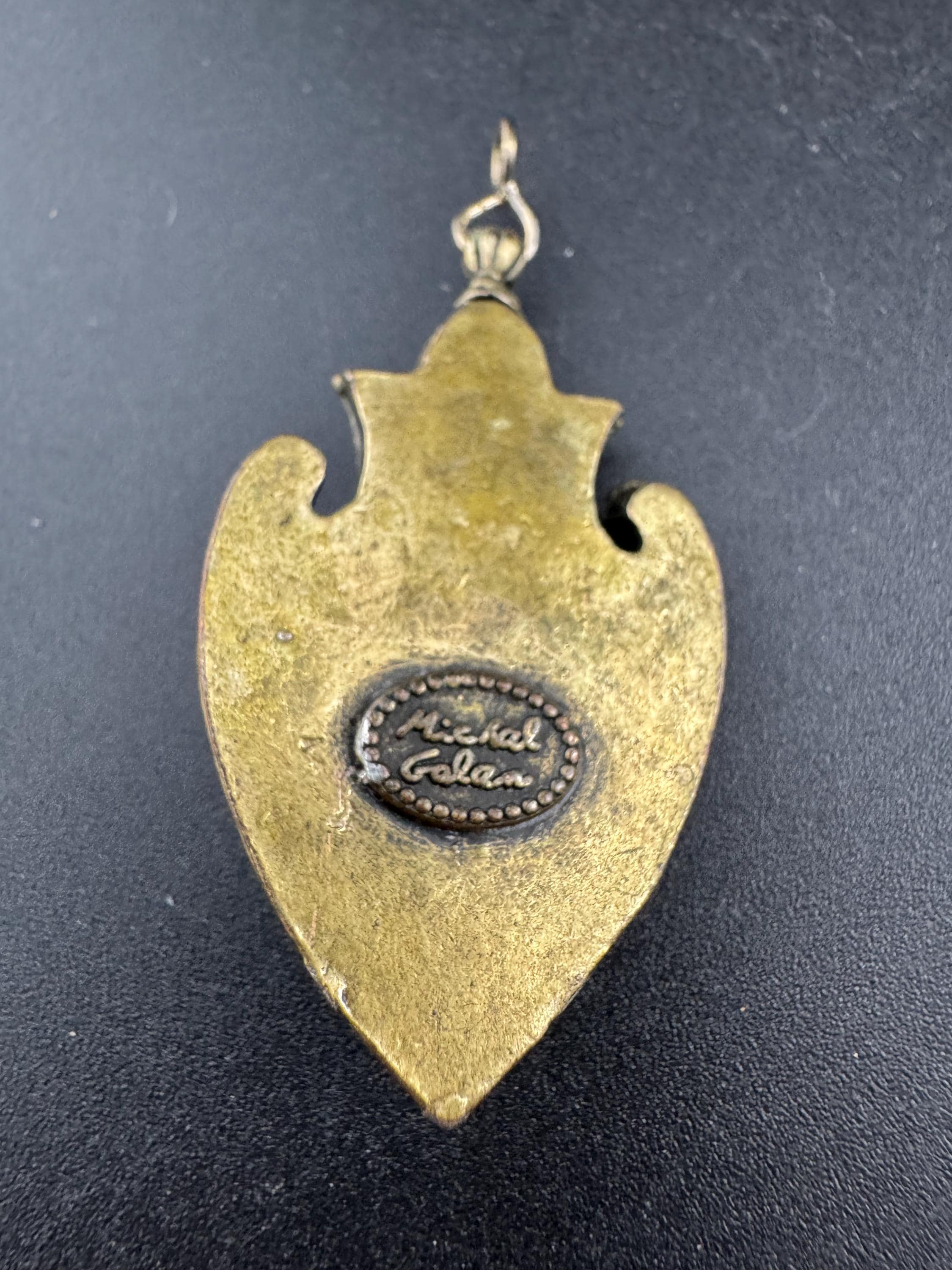 signed Michal Golan New York gold tone genstobe pendant,  Middle Eastern jewellery designer