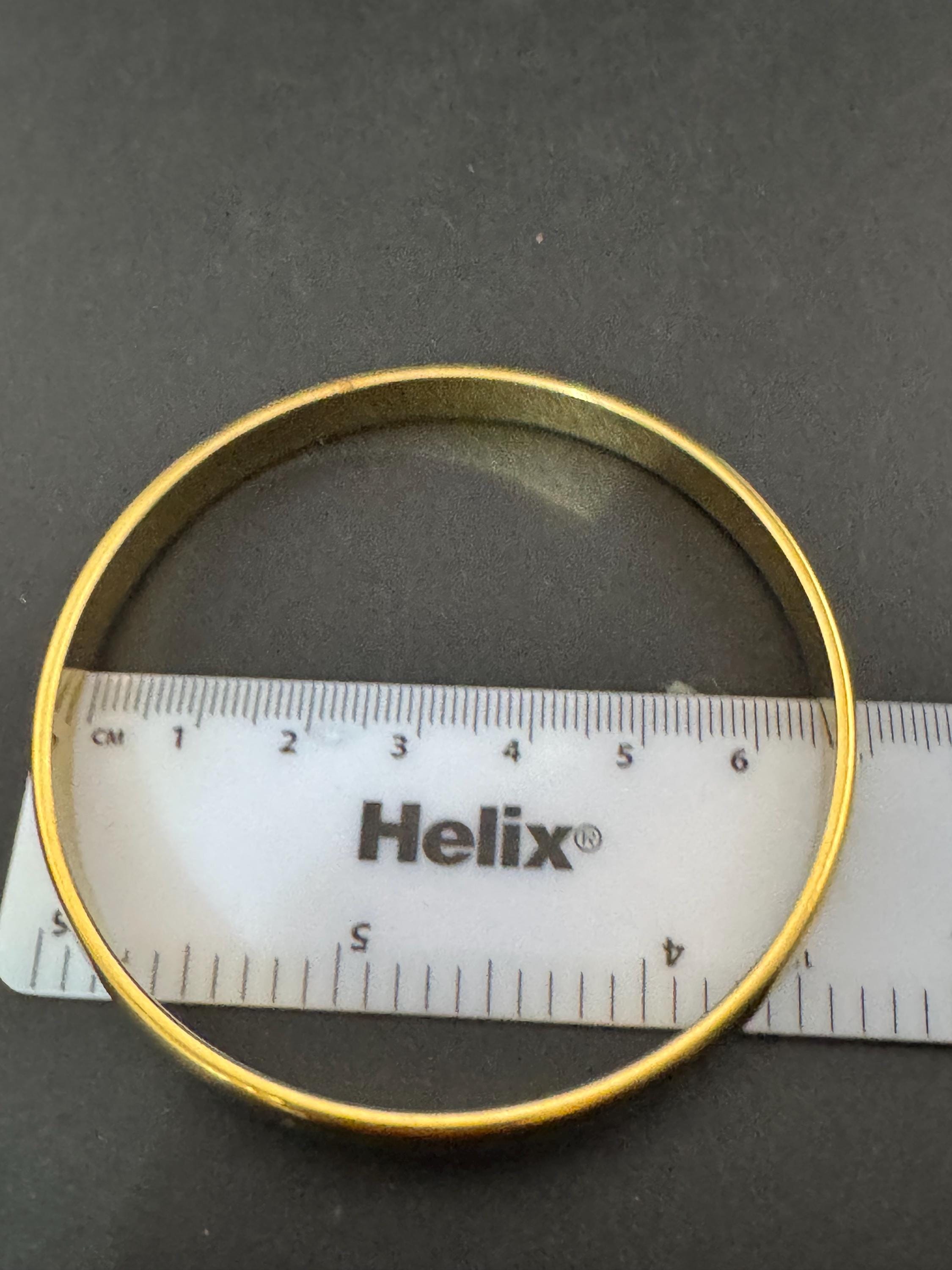 Vintage designer MONET signed glossy gold tone 1cm wide fixed bangle bracelet