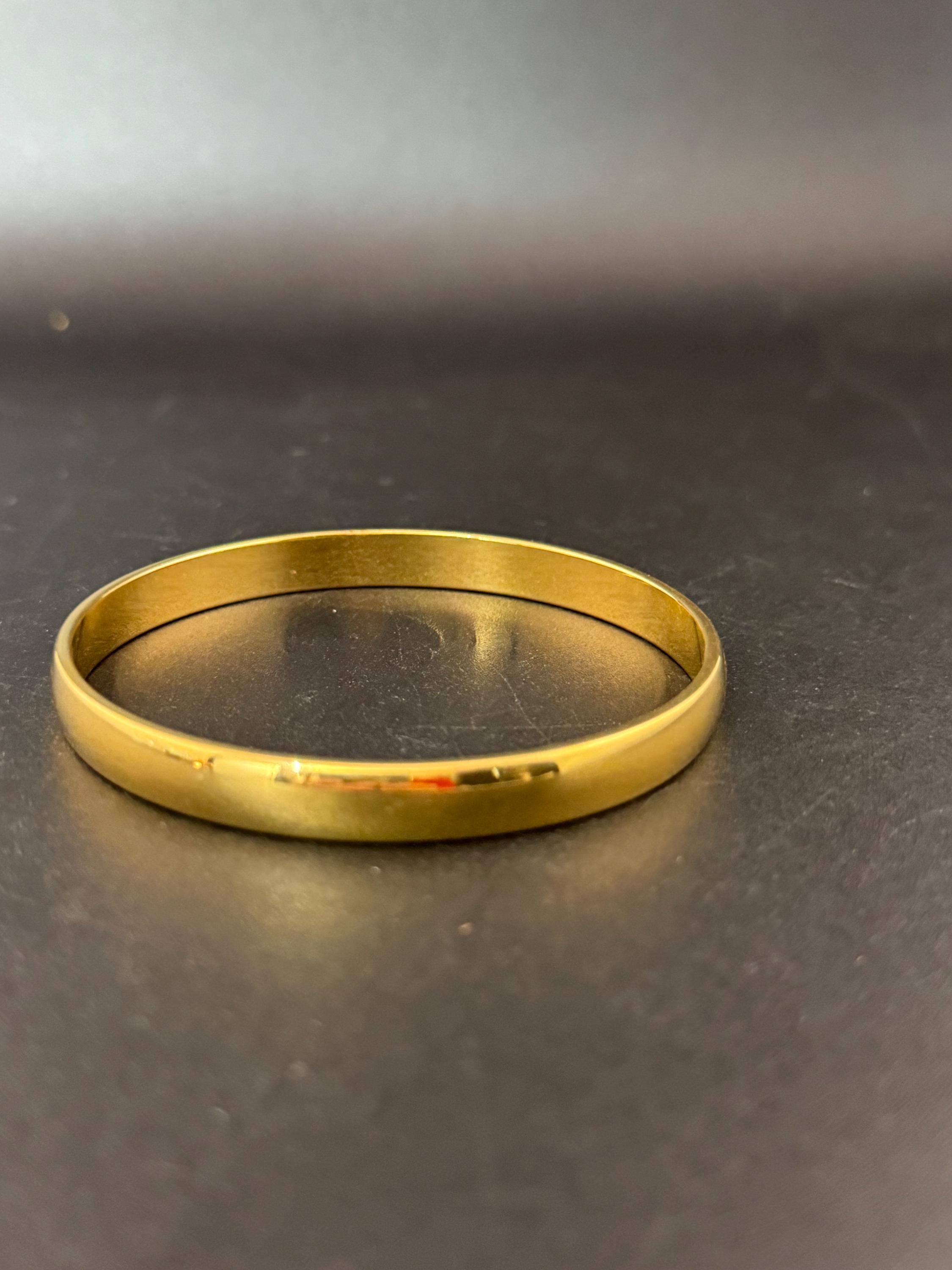 Vintage designer MONET signed glossy gold tone 1cm wide fixed bangle bracelet