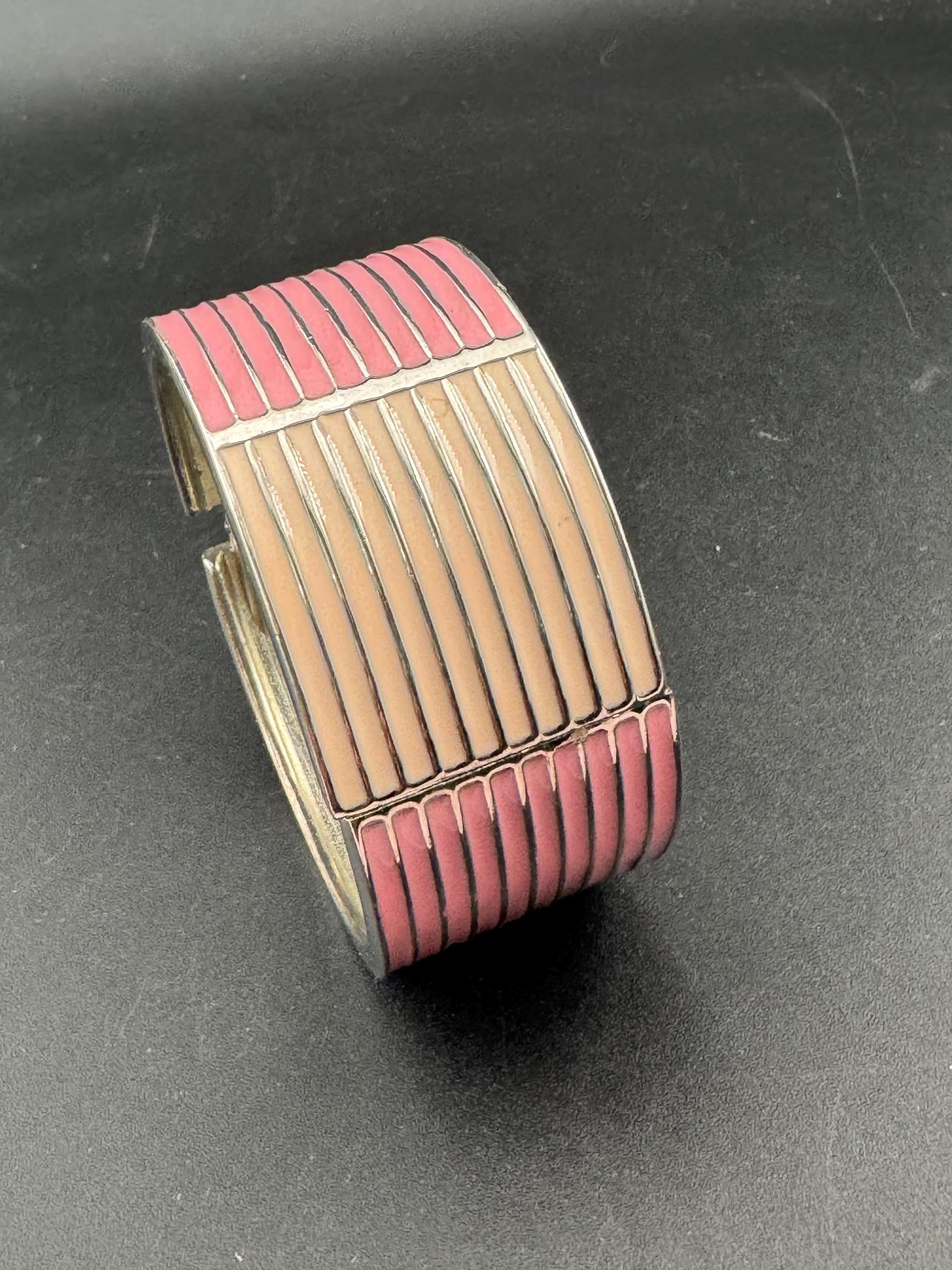 Vintage wide silver tone hinged pink enamel clamper bangle bracelet