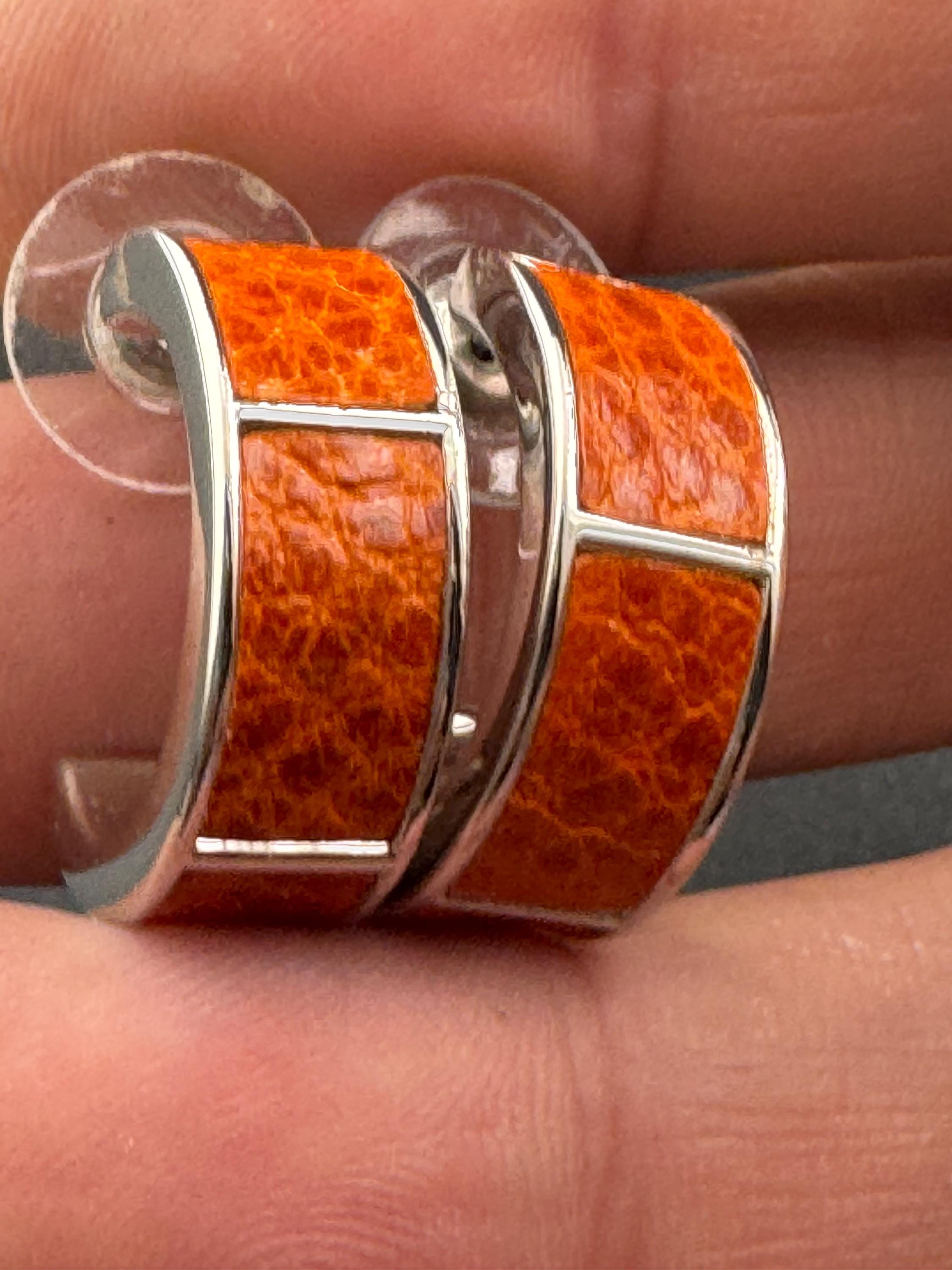 Retro silver tone wide bright orange animal print  hoop pierced earrings