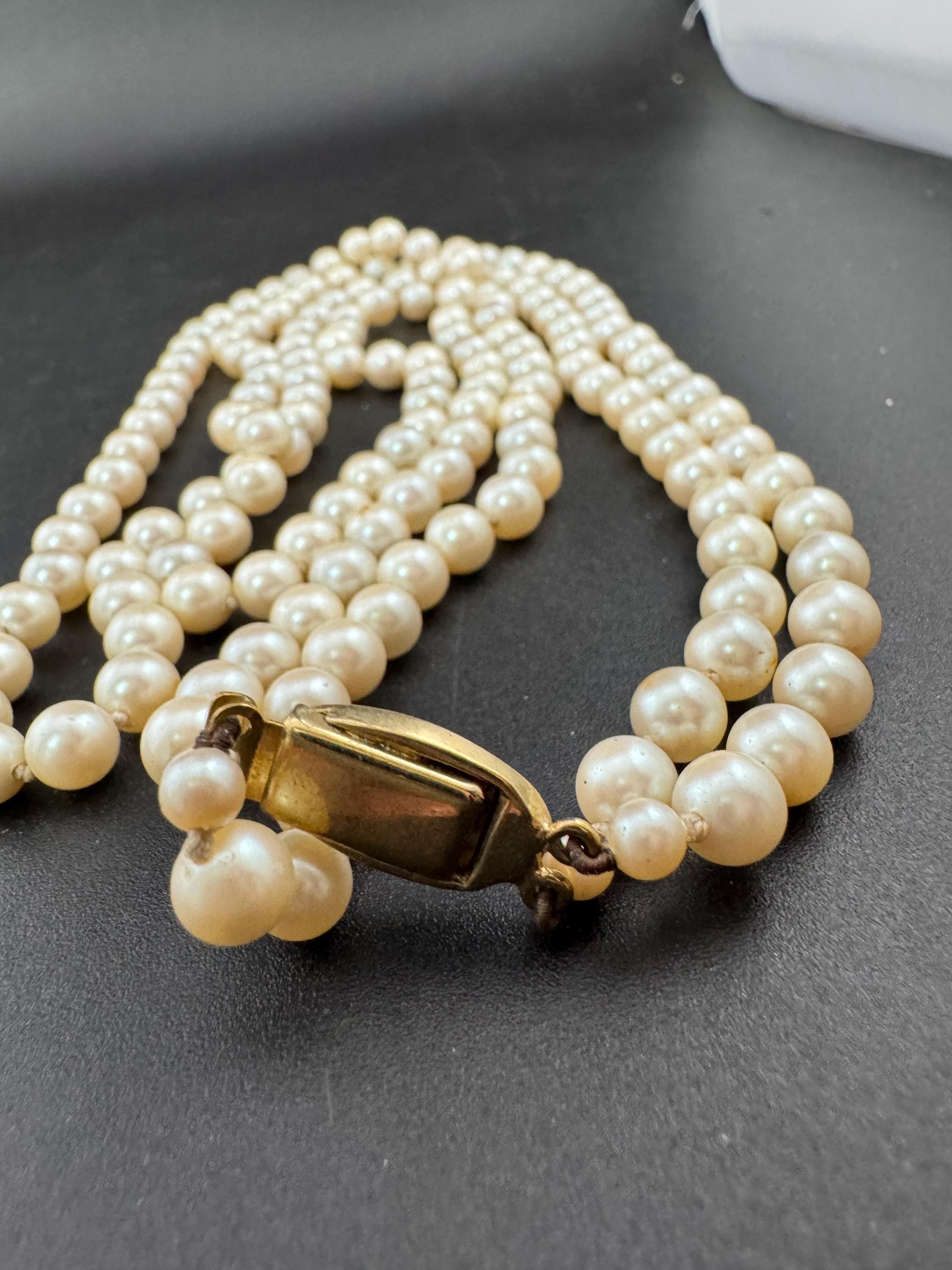 Cream Knotted Glass Pearl Necklace: Gold Plated Enamel Clasp