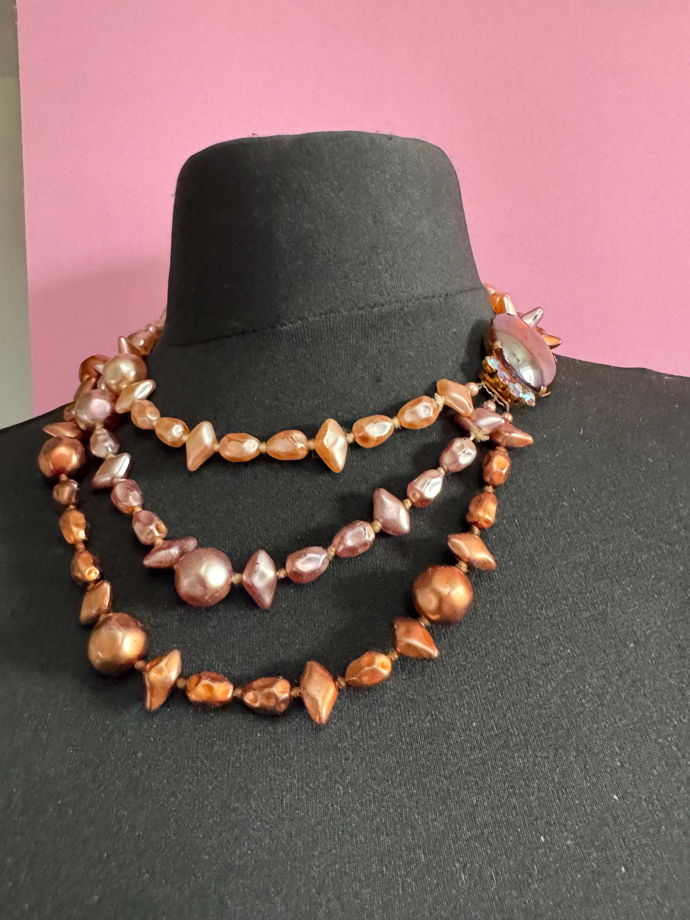 Fantastic Vintage triple strand row brown pink bronze glass faux pearl beaded multistrand necklace with a huge glass cabochon clasp