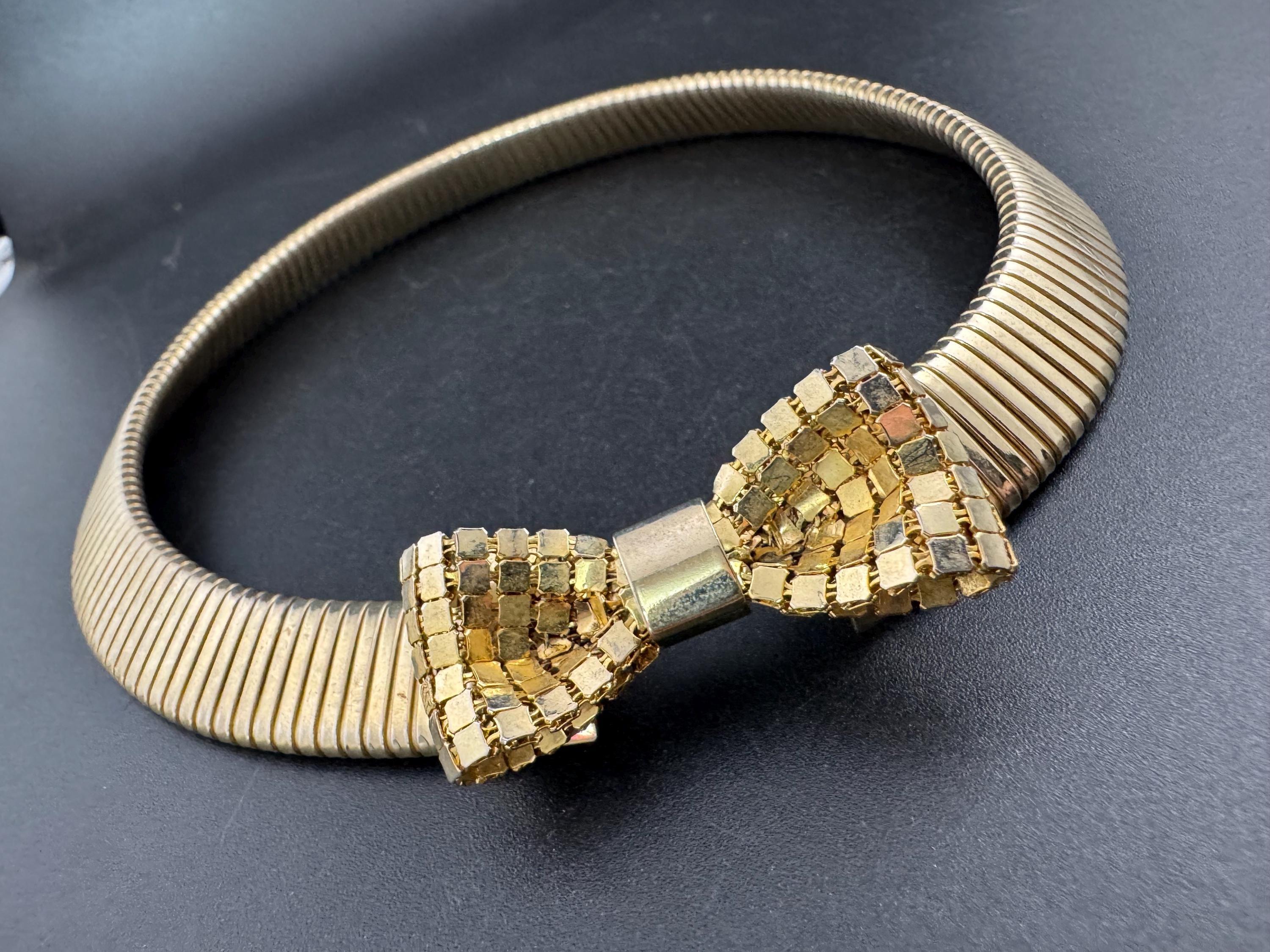 Vintage 1980s gold tone omega choker collar necklace with mesh bow detail