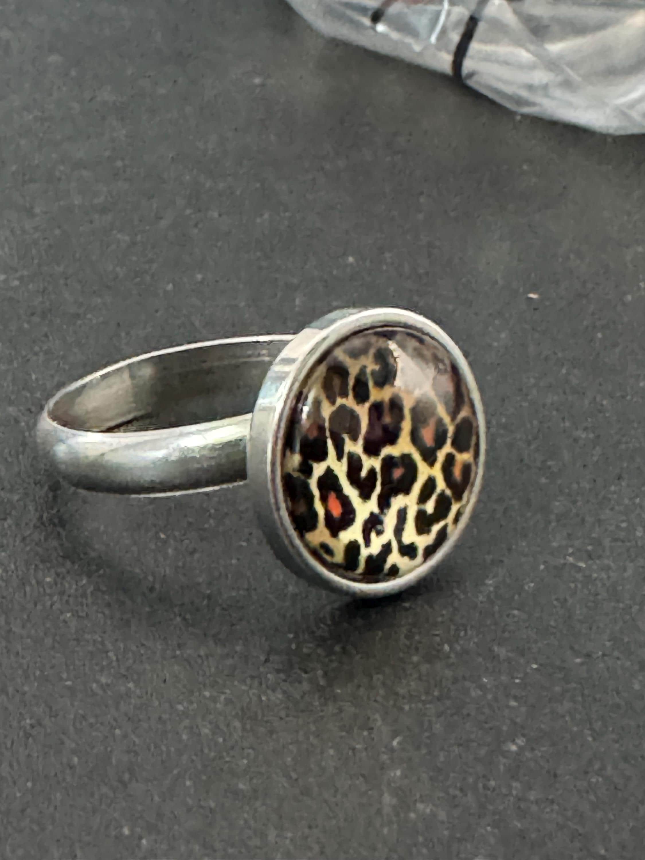 Adjustable 14mm bezel set Leopard print ring made from stainless steel, non Tarnish with a glass cabochon