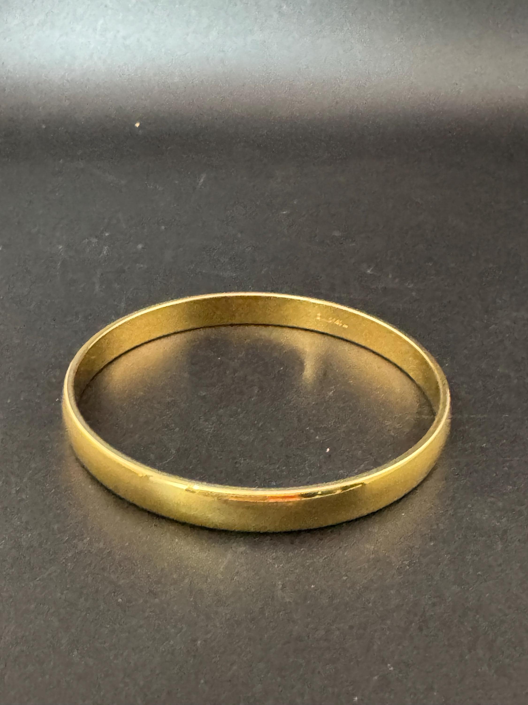 Vintage designer MONET signed glossy gold tone 1cm wide fixed bangle bracelet