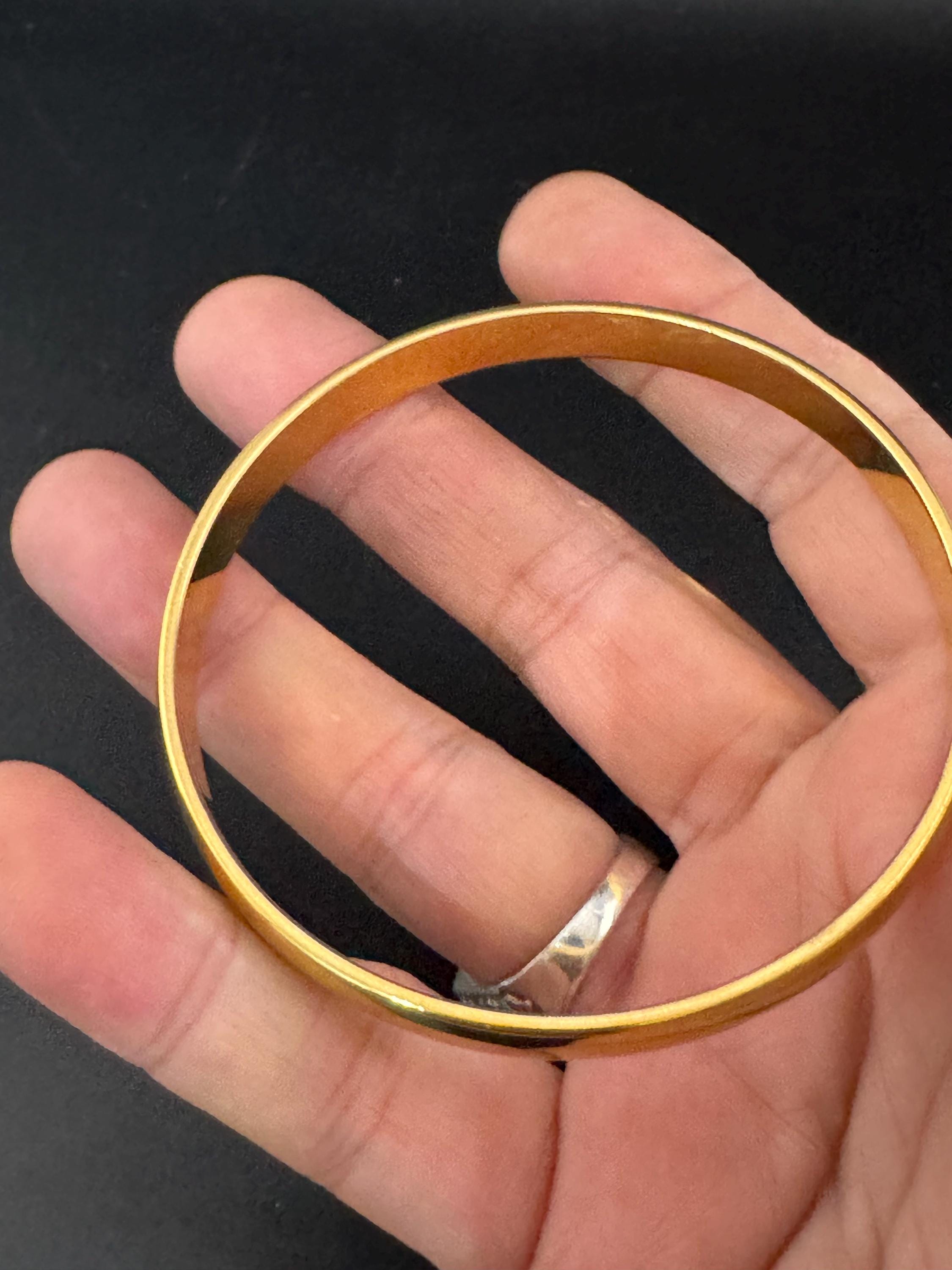 Vintage designer MONET signed glossy gold tone 1cm wide fixed bangle bracelet