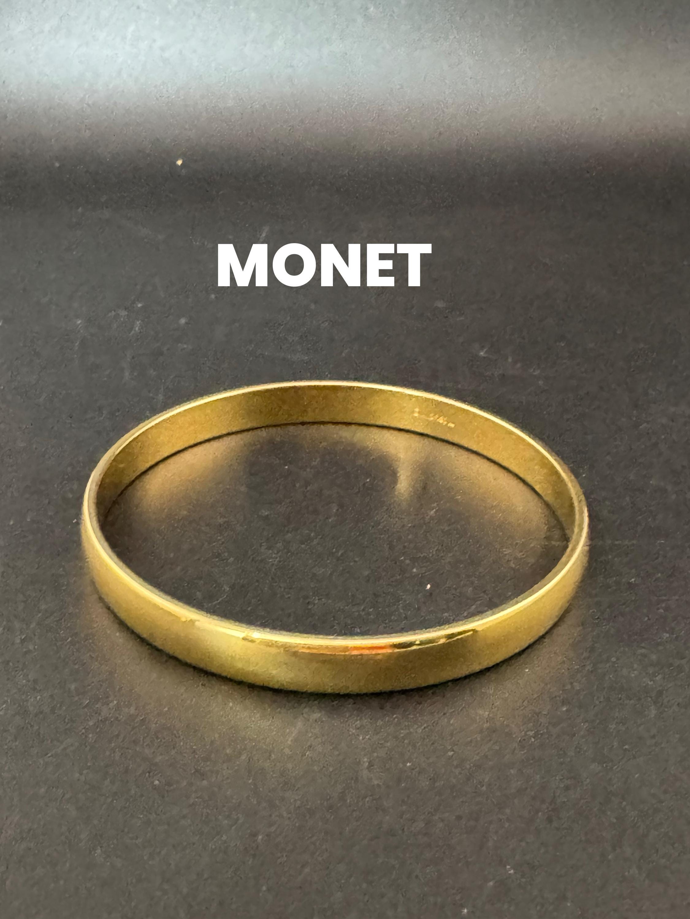 Vintage designer MONET signed glossy gold tone 1cm wide fixed bangle bracelet