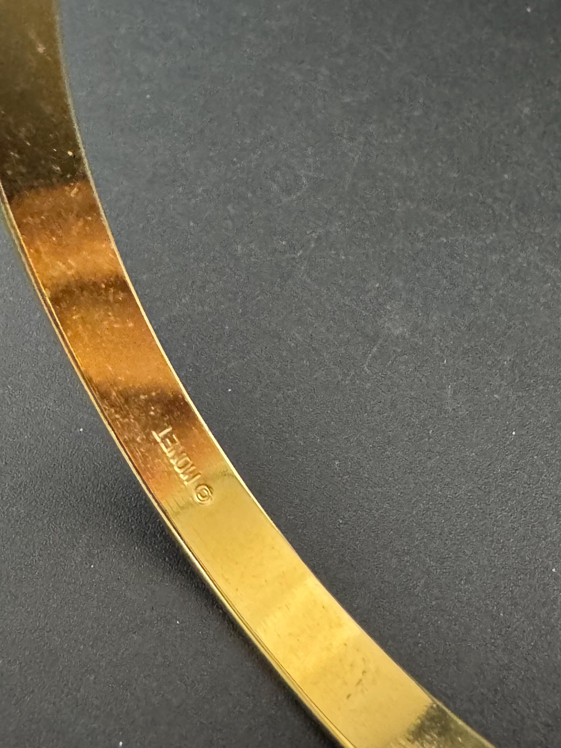 Vintage designer MONET signed glossy gold tone black enamel banded 1cm wide fixed bangle bracelet