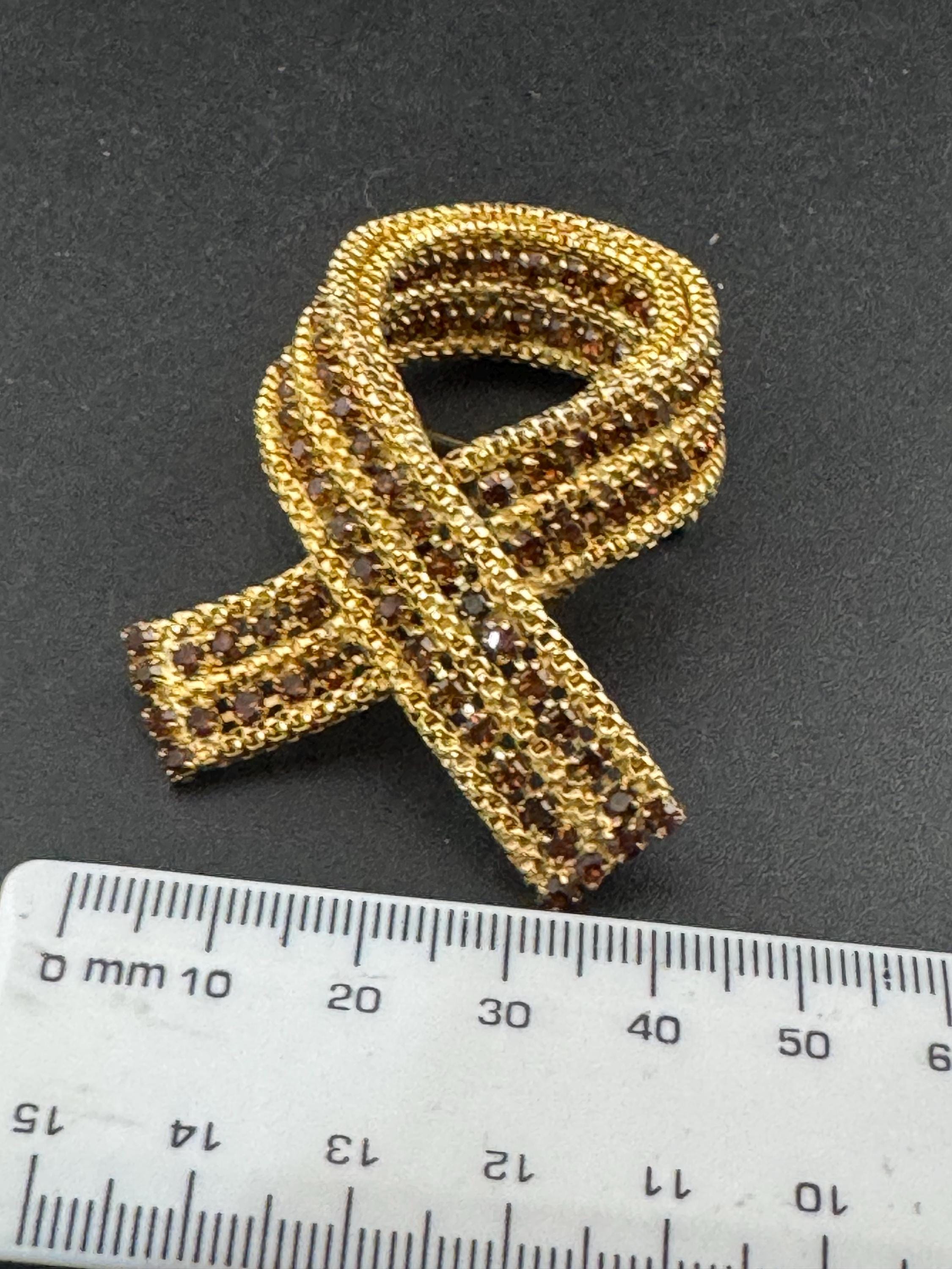 vintage gold tone mesh brown cognac glass rhinestone cross knot brooch 1960s