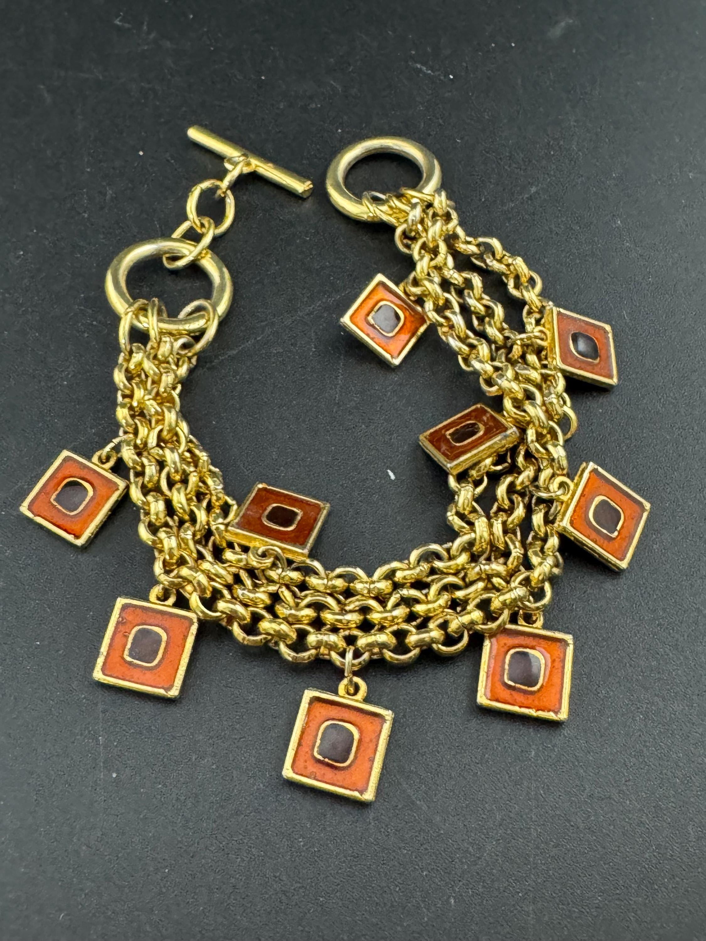 Vintage high end orange and black enamel chain link statement Multistrand charm bracelet gold tone unsigned