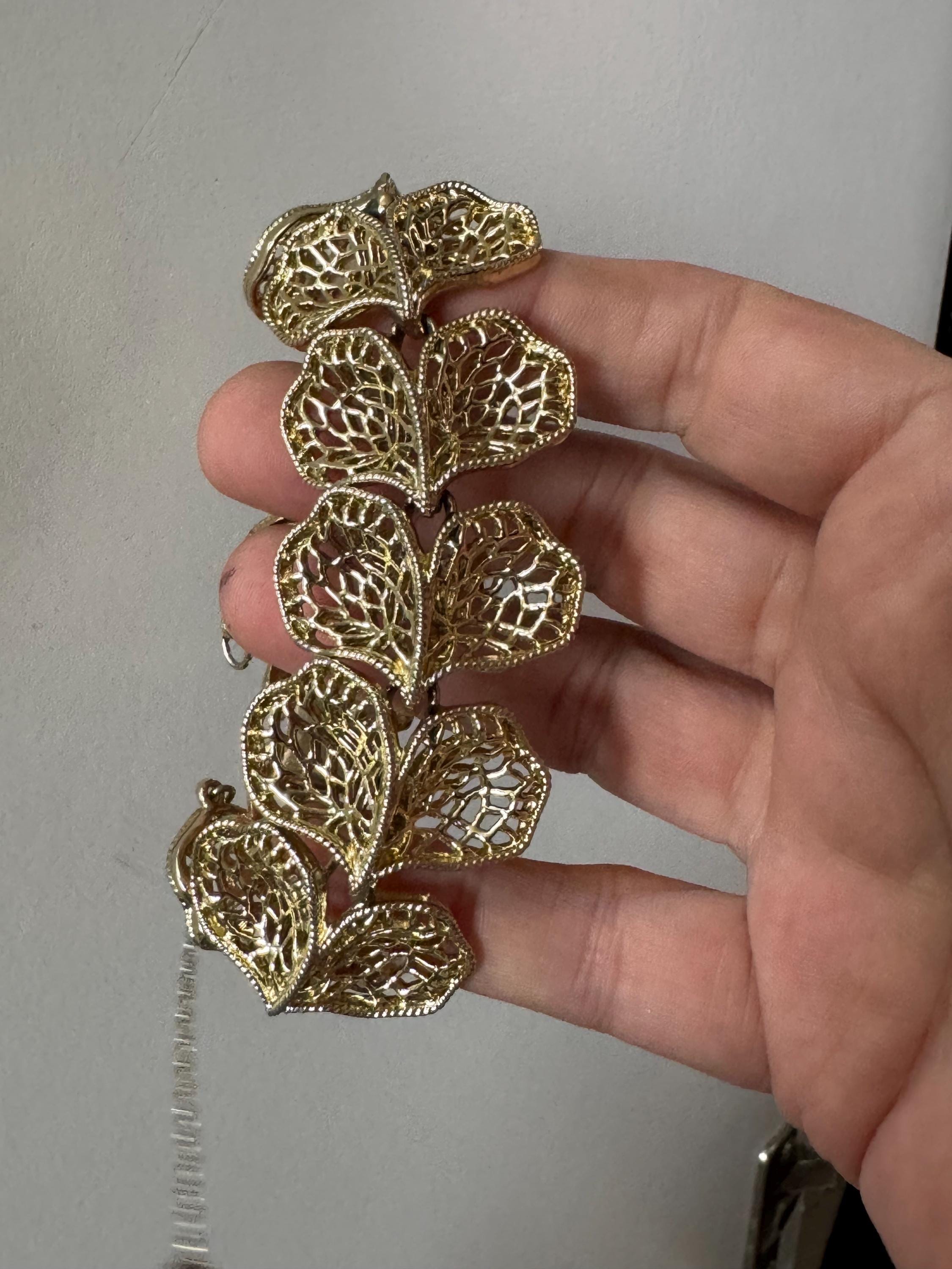 Mid century vintage very wide gold tone floral leaf bracelet,  panel link openwork with safety chain