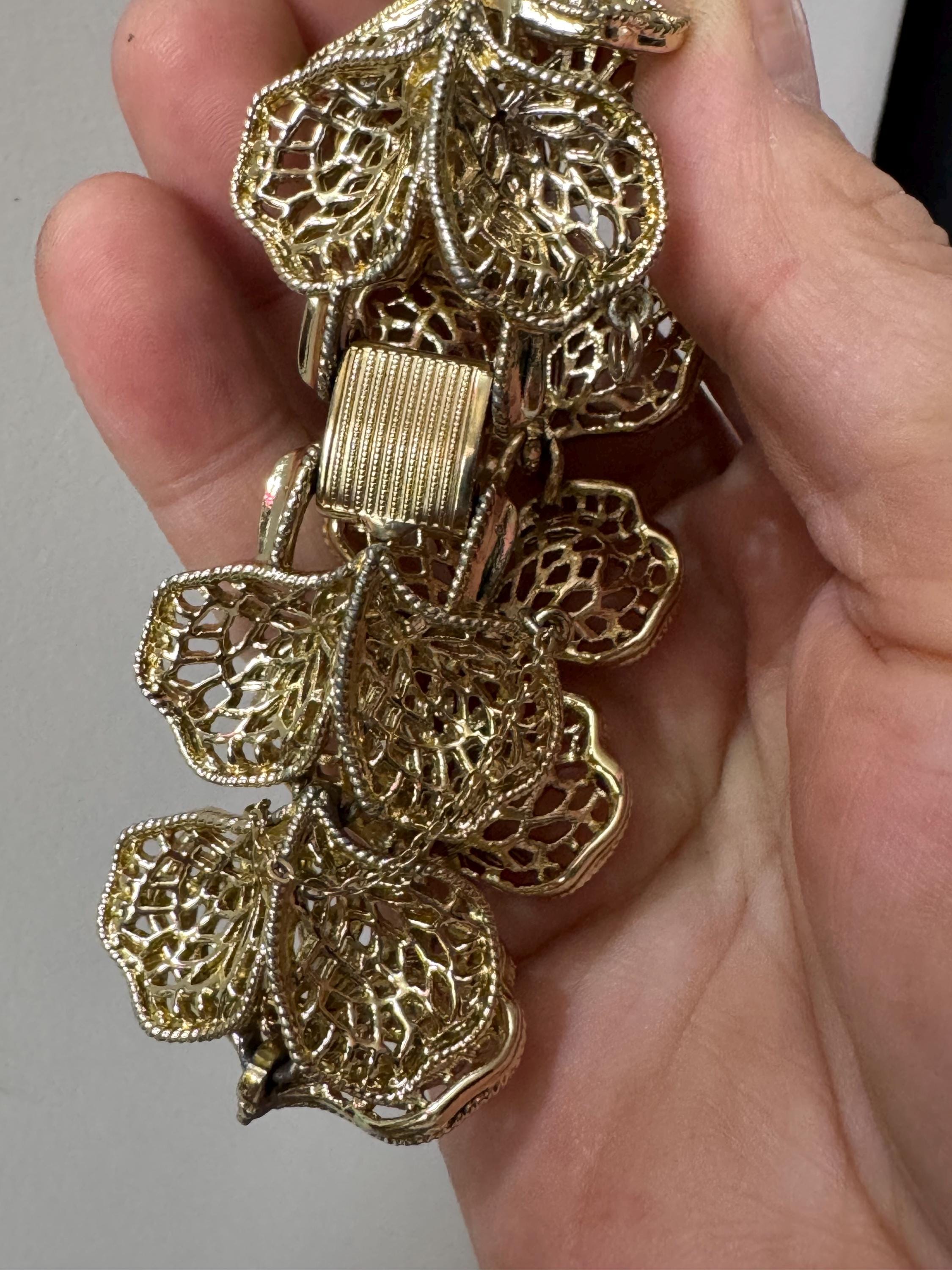 Mid century vintage very wide gold tone floral leaf bracelet,  panel link openwork with safety chain