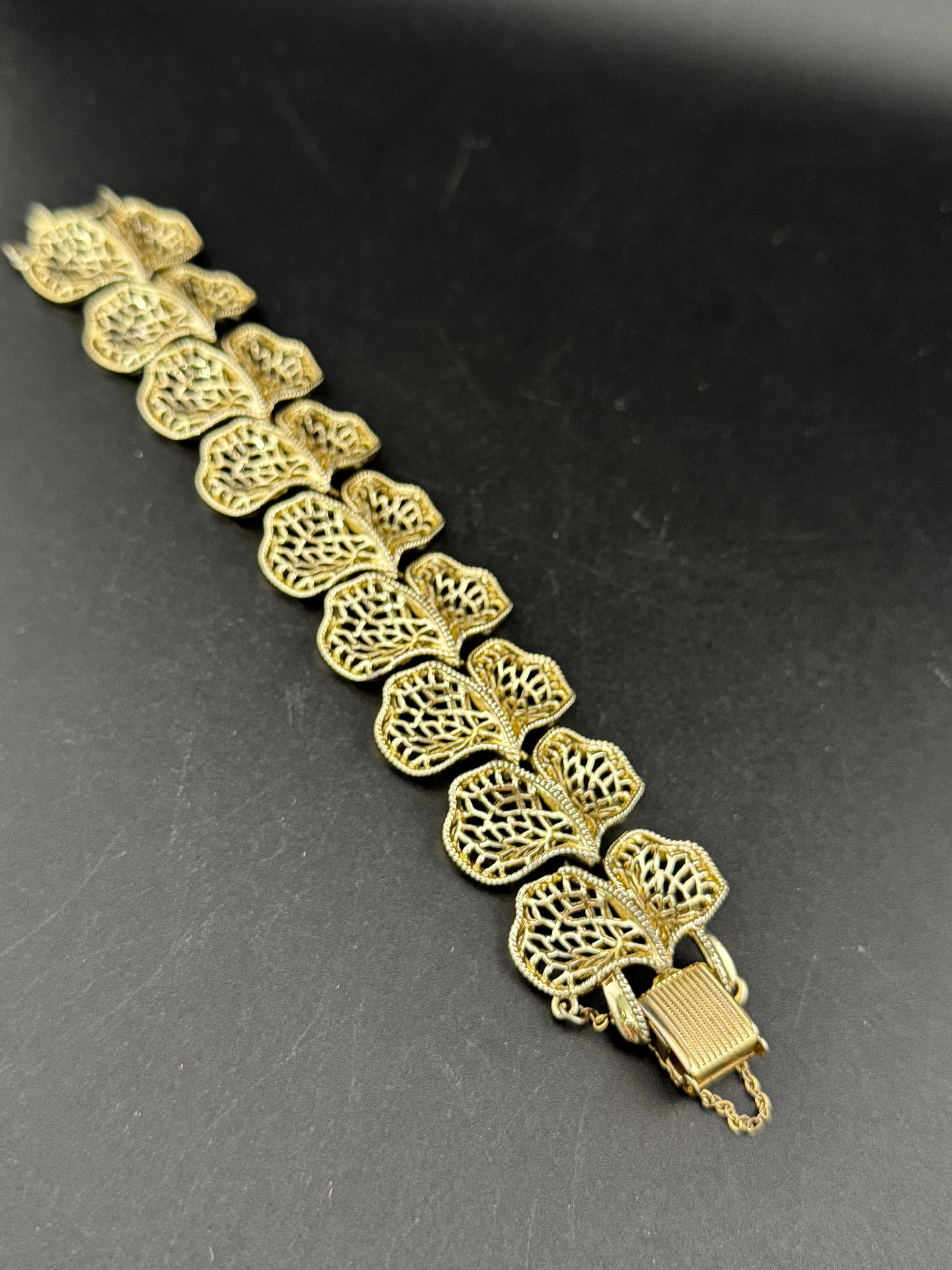 Mid century vintage very wide gold tone floral leaf bracelet,  panel link openwork with safety chain