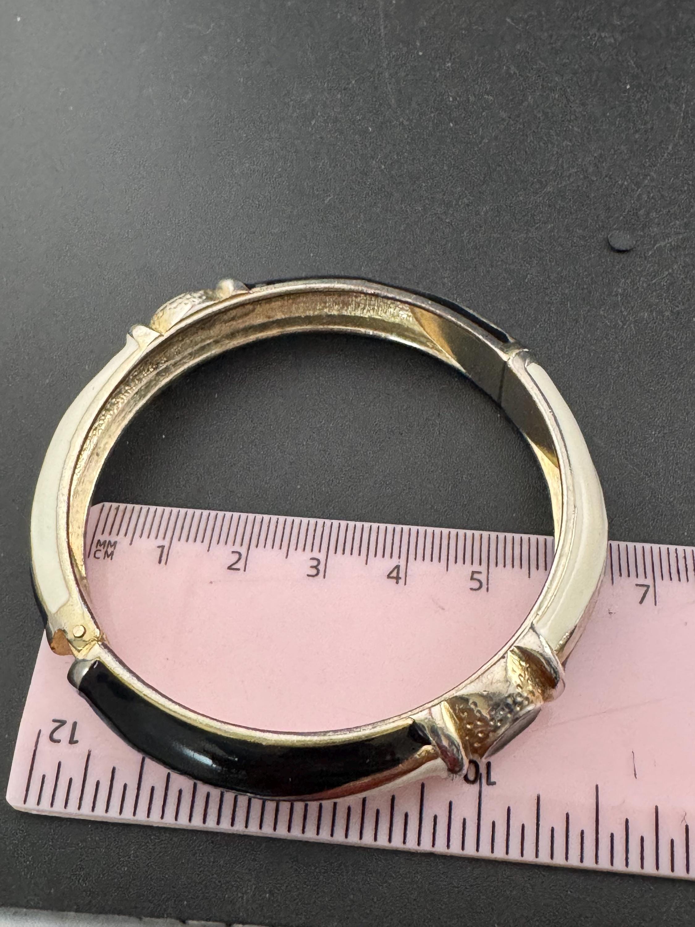 Vintage cream and black enamel hinged clamper bangle , 80s