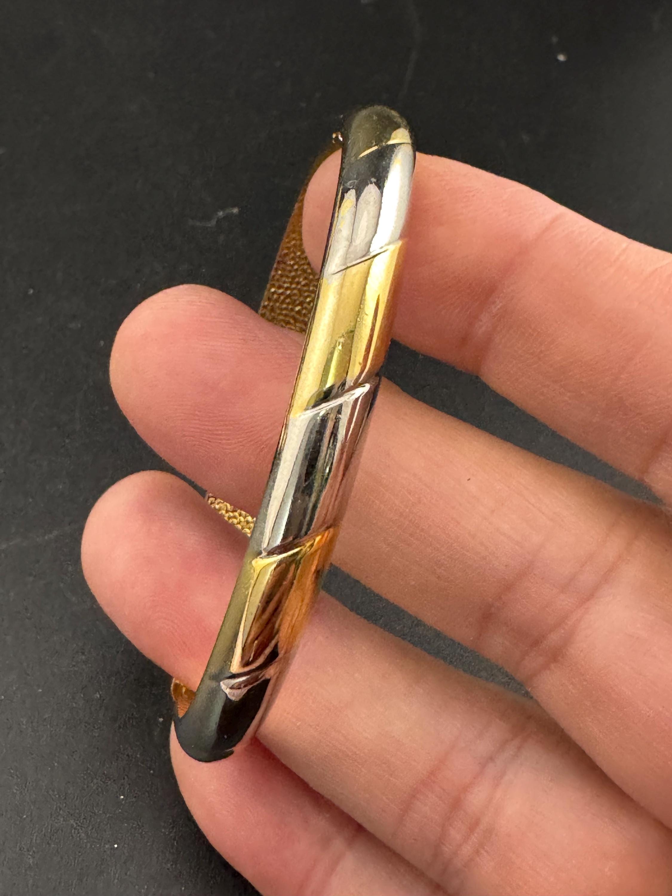 Vintage slim silver and gold tone striped hinged bangle bracelet