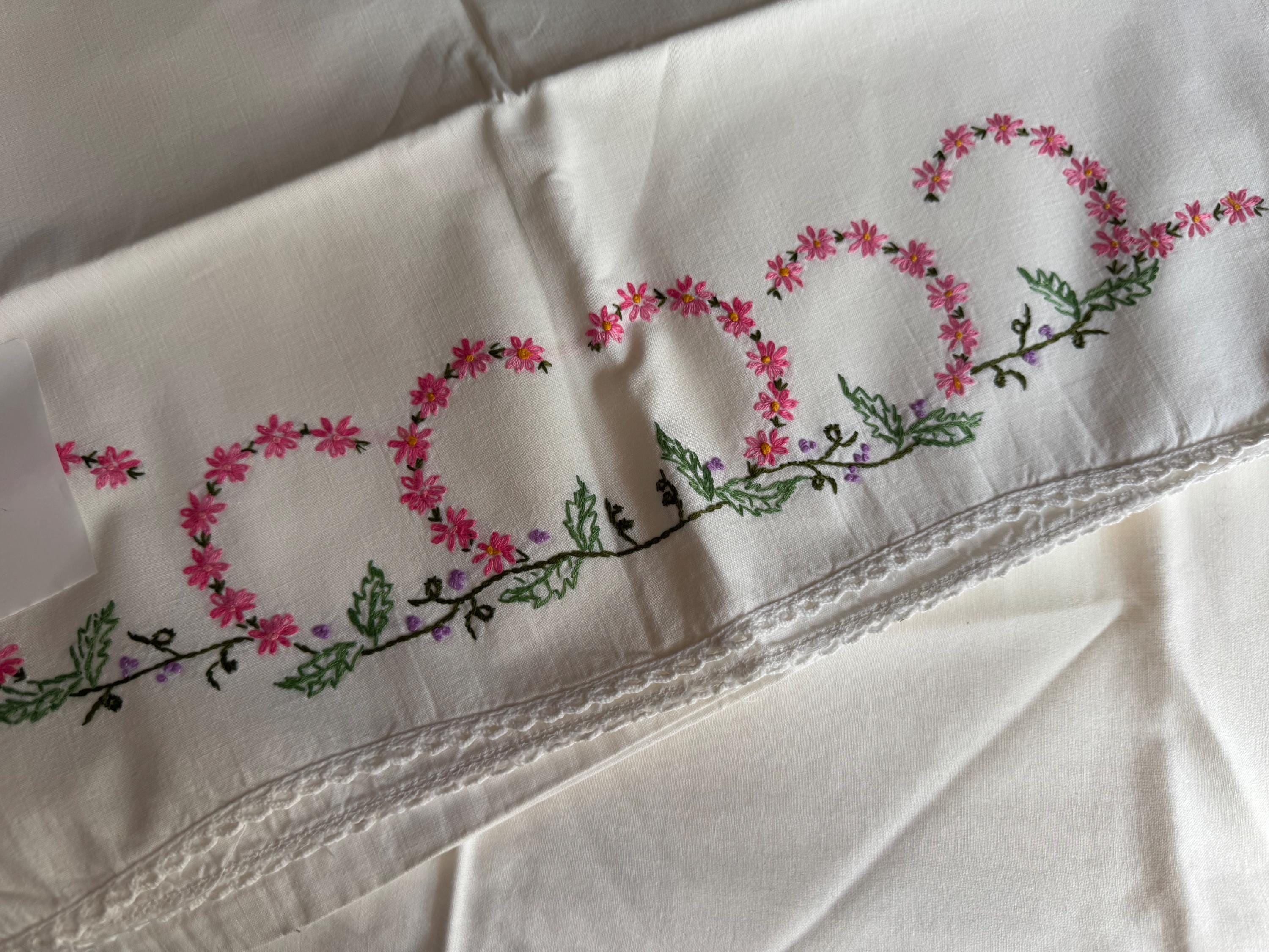 Vintage HAND embroidered floral pair of pillowcases pink green purple flowers pastels