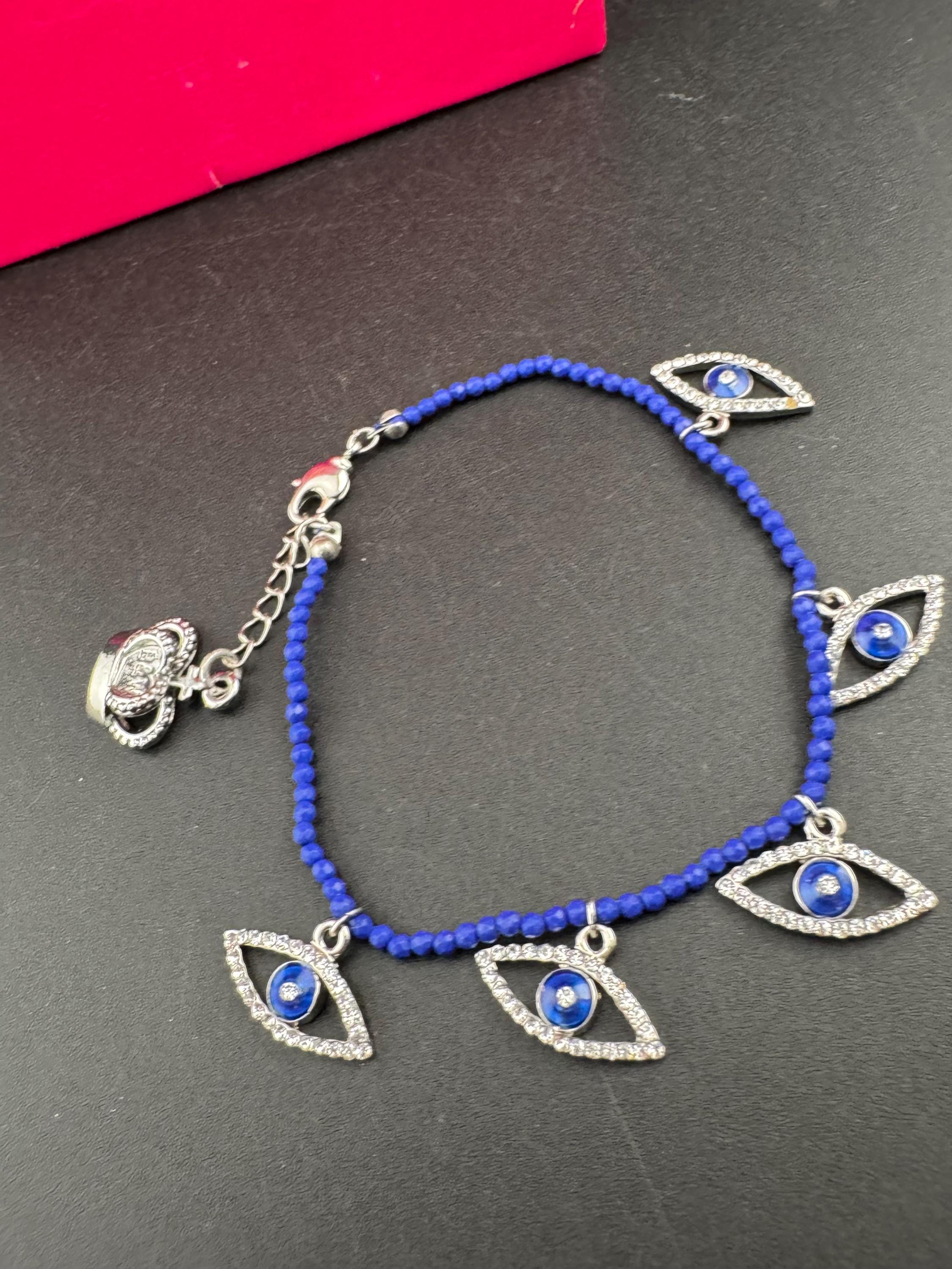 Retro Butler and Wilson boxed dainty clear diamanté blue evil eye silver tone tennis charm bracelet