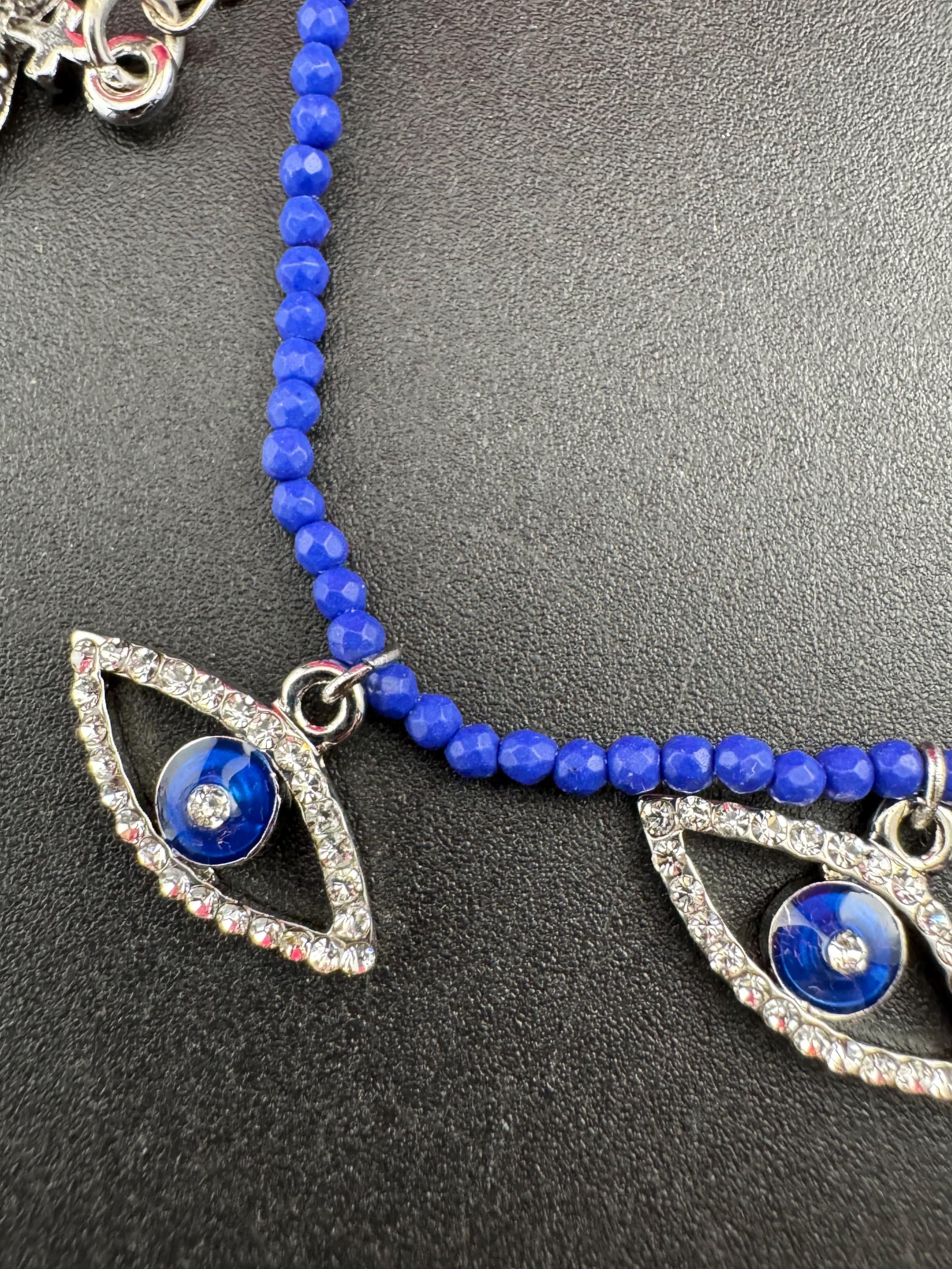 Retro Butler and Wilson boxed dainty clear diamanté blue evil eye silver tone tennis charm bracelet