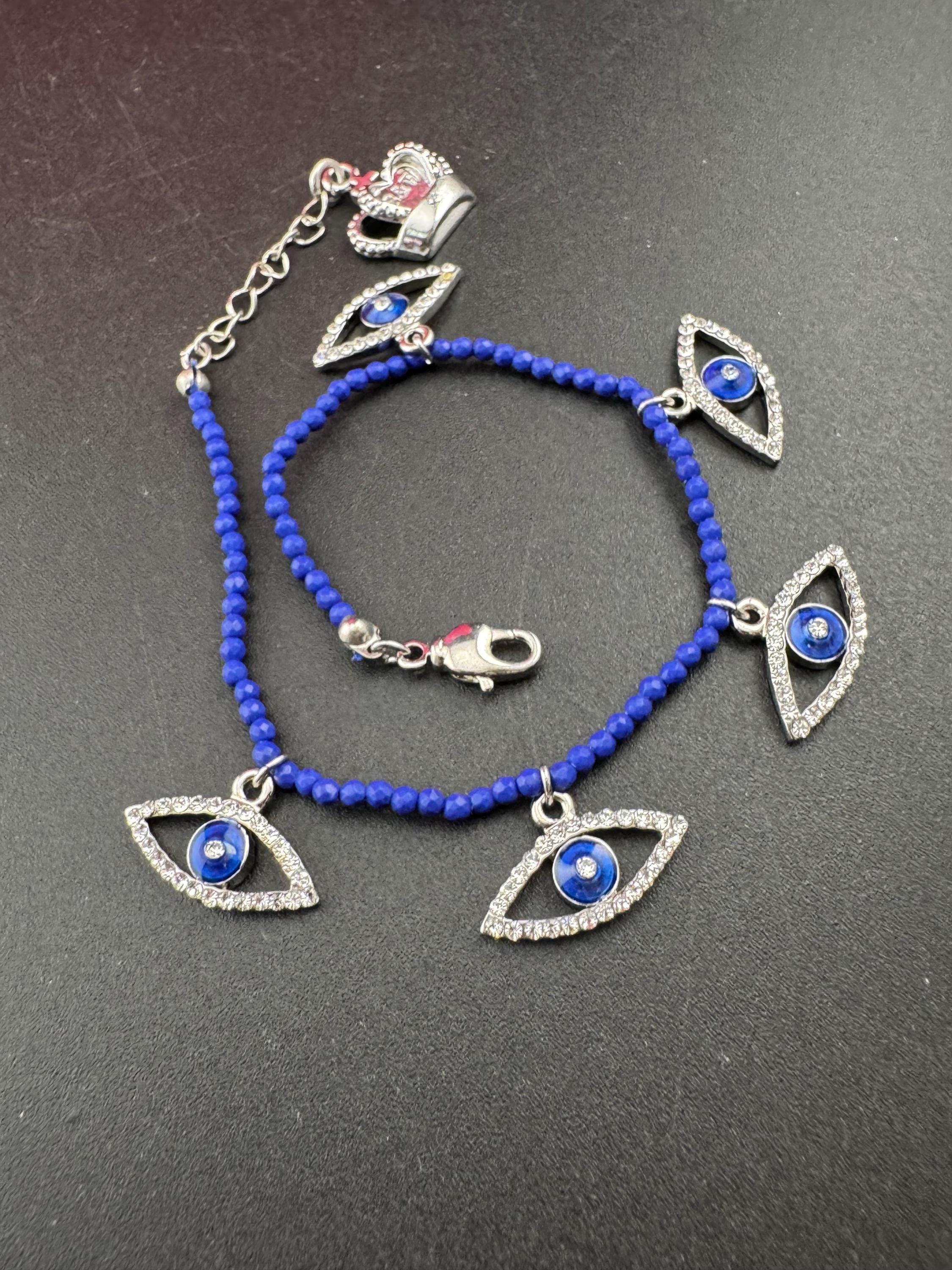 Retro Butler and Wilson boxed dainty clear diamanté blue evil eye silver tone tennis charm bracelet