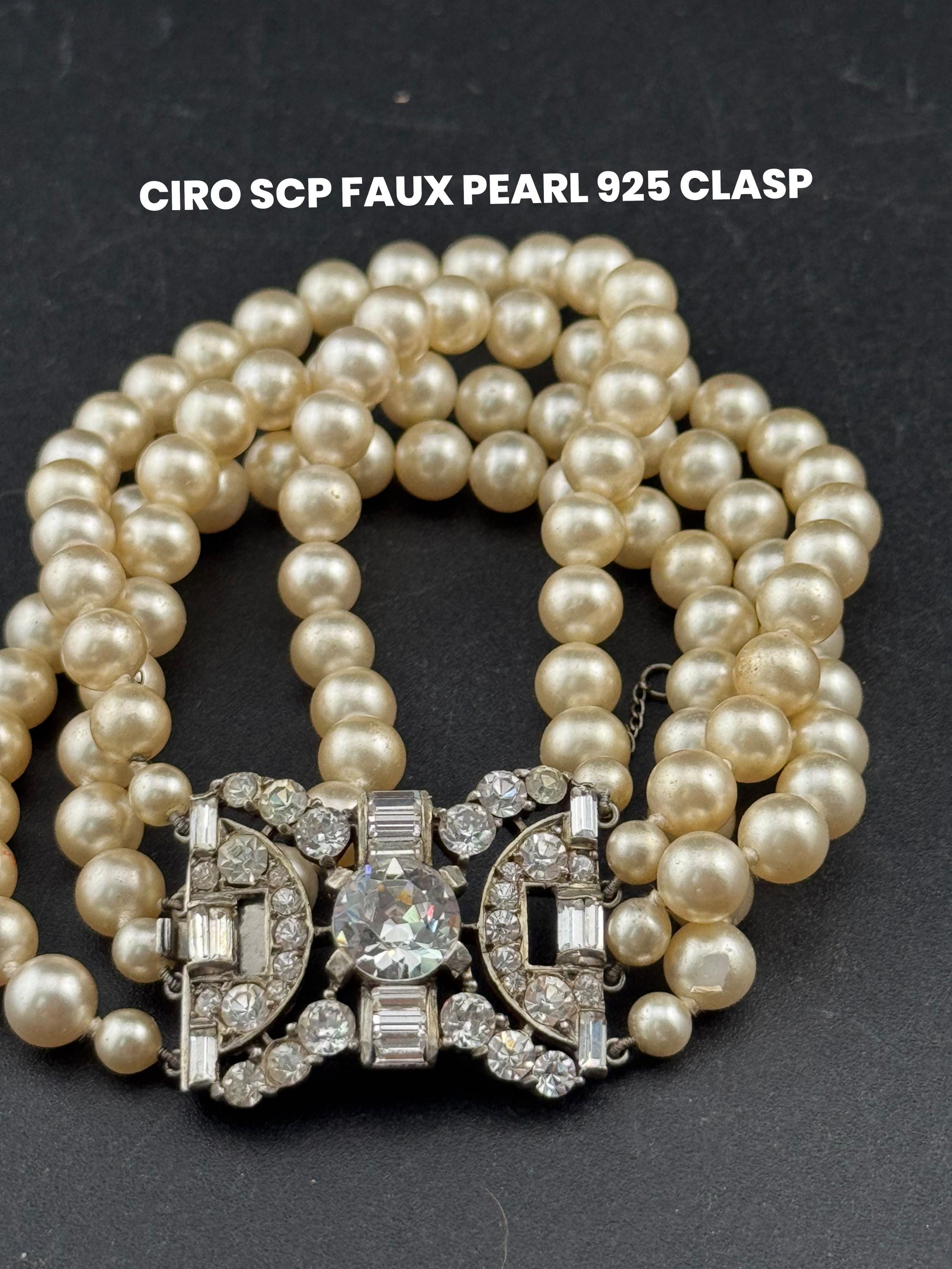 Vintage signed SCP (Coro)  high end  tone faux pearl Multistrand bracelet with sterling silver rhinestone clasp