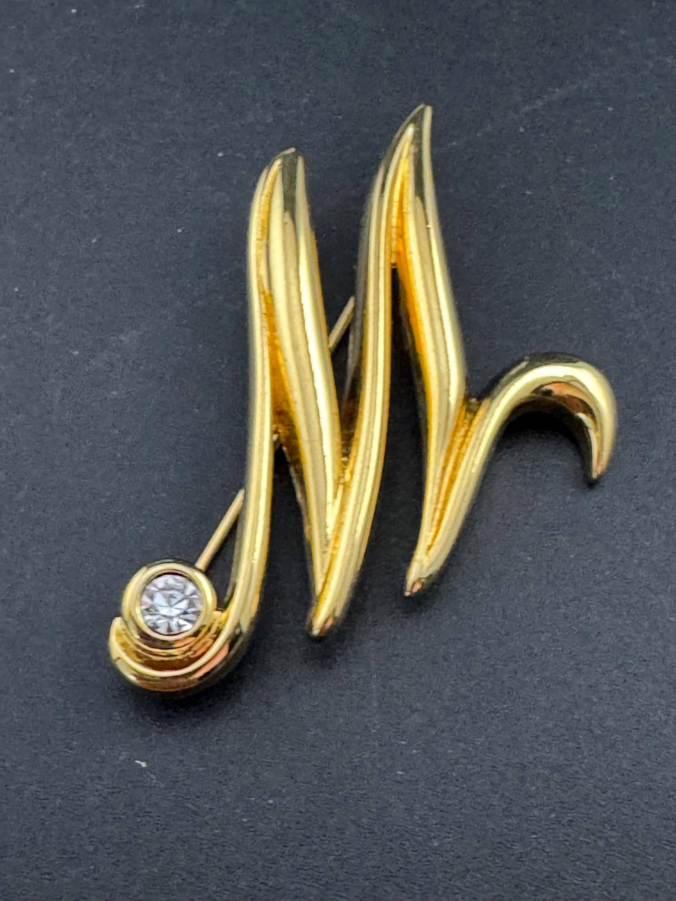 Signed MONET letter M monogram name brooch, gold tone 5cm