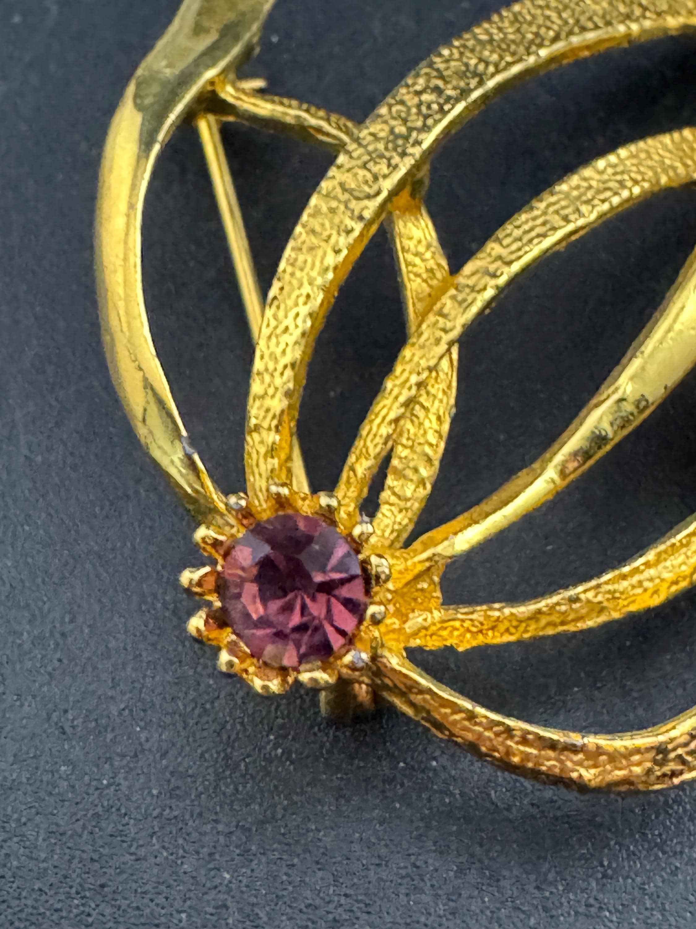 HOLLYWOOD signed abstract swirl brooch with amethyst rhinestone