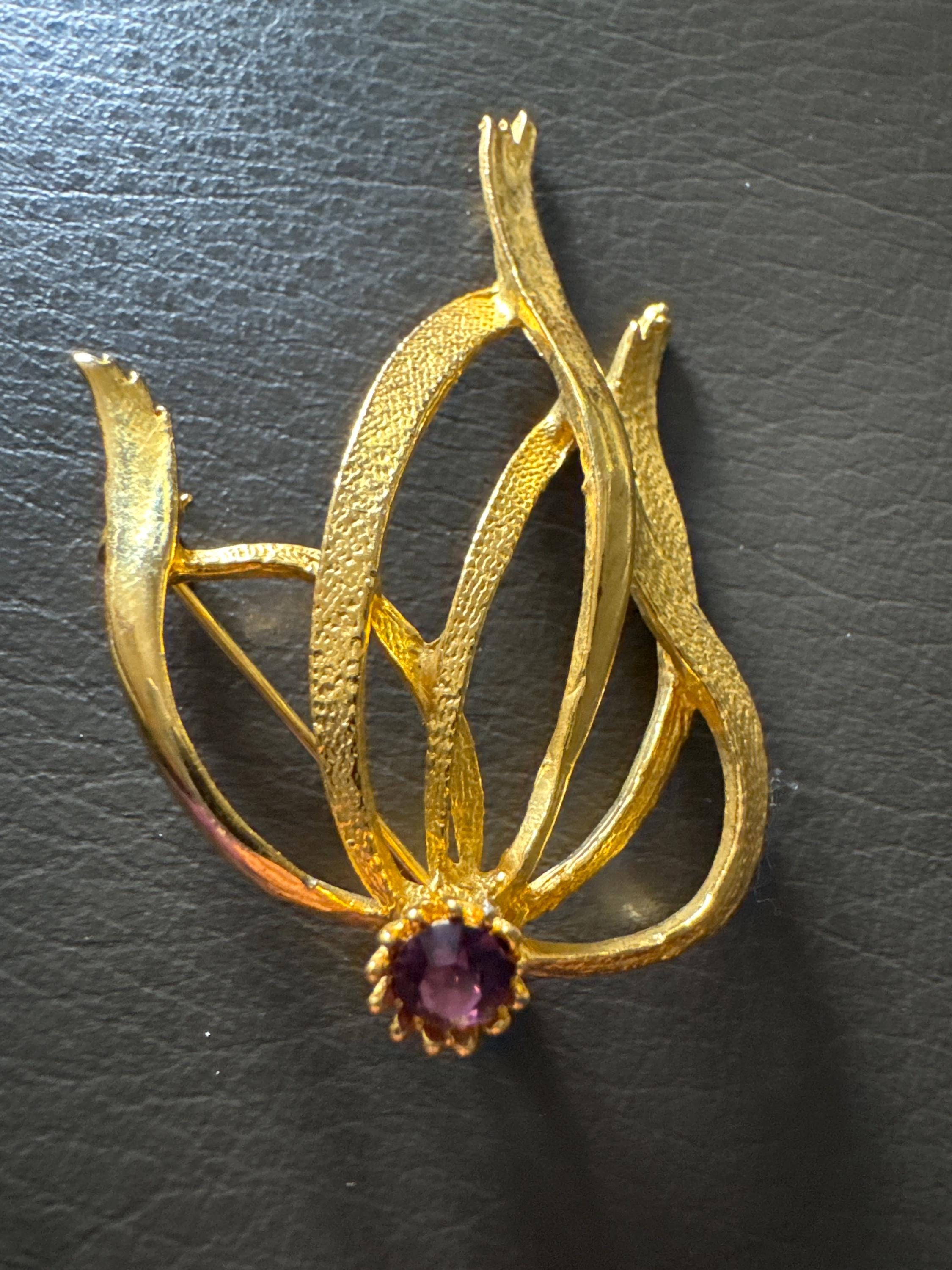 HOLLYWOOD signed abstract swirl brooch with amethyst rhinestone