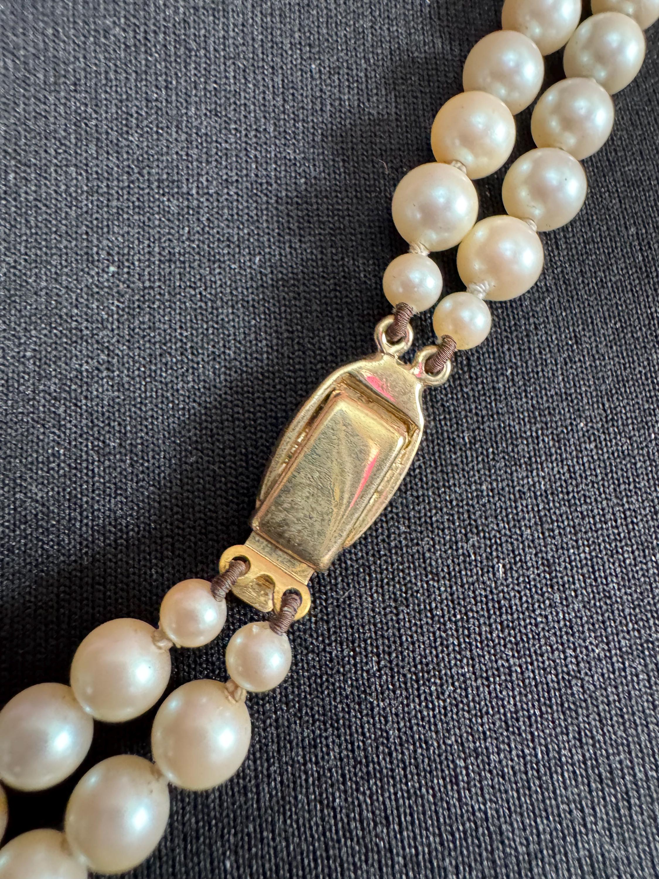 Cream Knotted Glass Pearl Necklace: Gold Plated Enamel Clasp