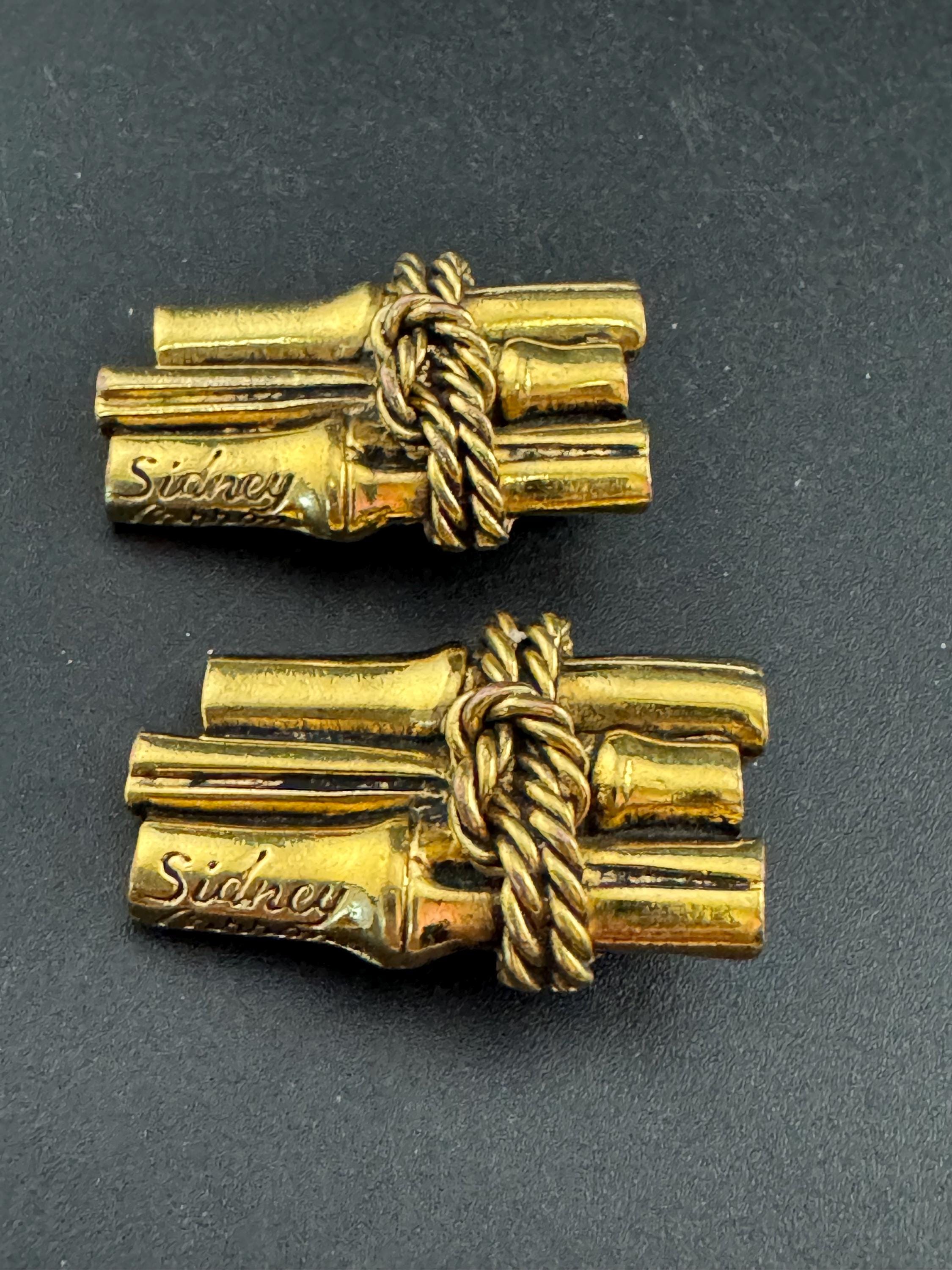Signed Sidney carron rope twist clip on earrings, designer gold tone