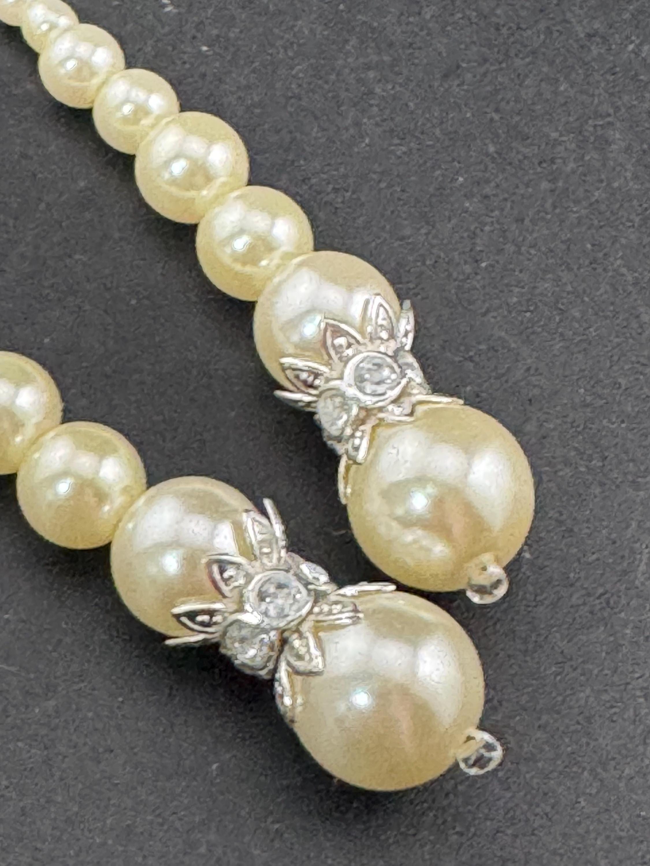 Retro Silver tone long plastic beaded faux pearl dangly drop earrings pierced ears with clear diamanté