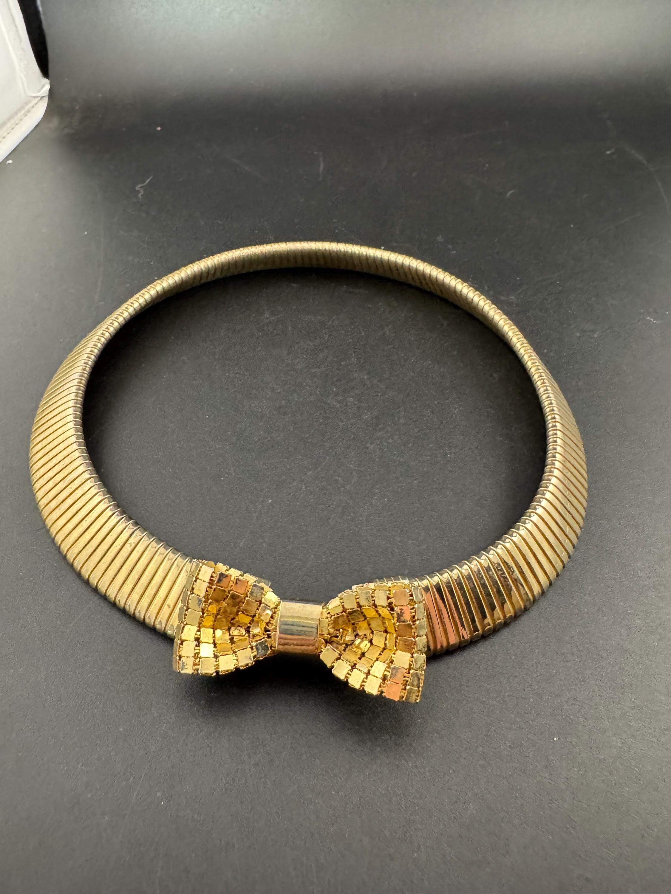 Vintage 1980s gold tone omega choker collar necklace with mesh bow detail