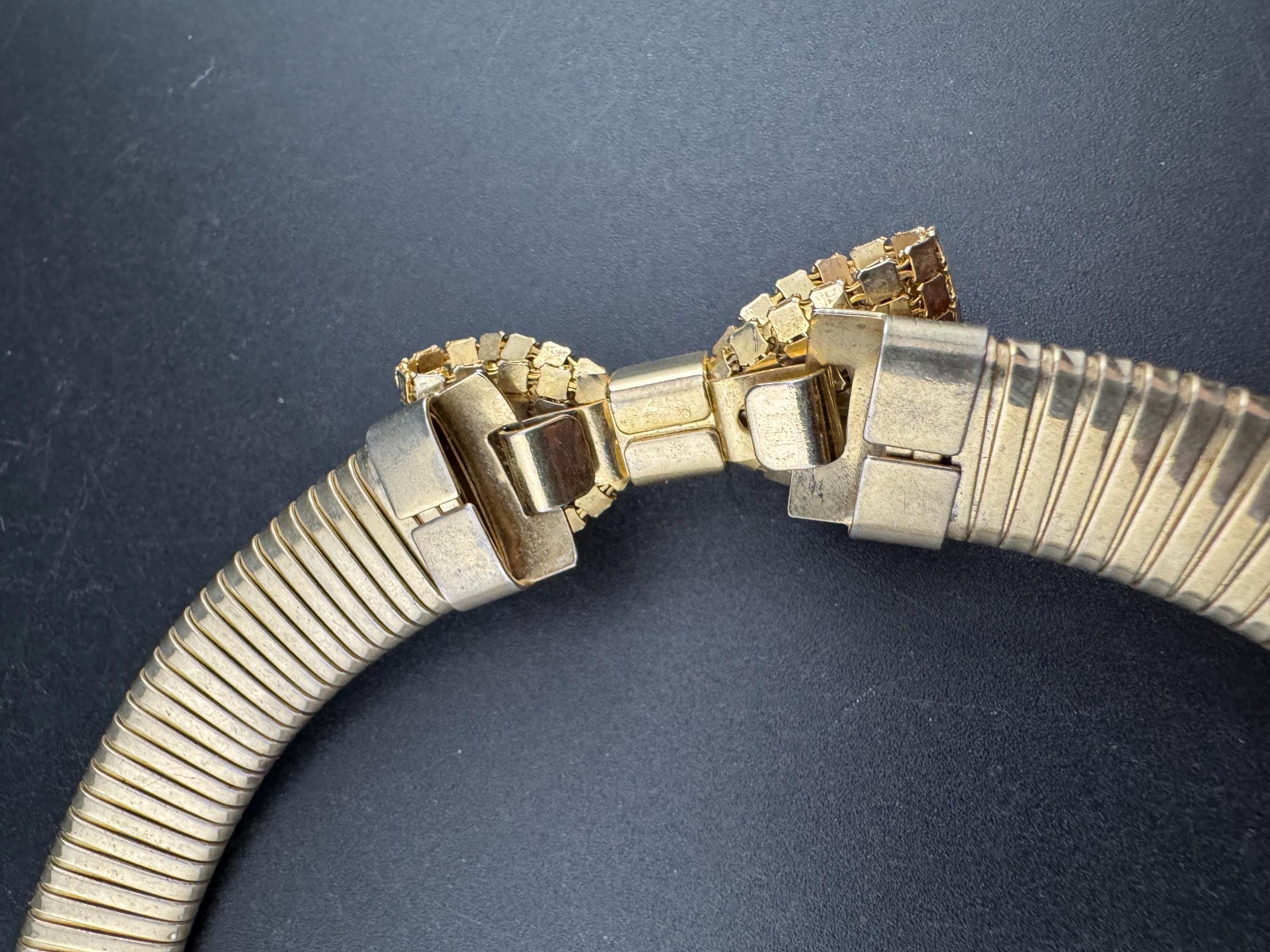Vintage 1980s gold tone omega choker collar necklace with mesh bow detail