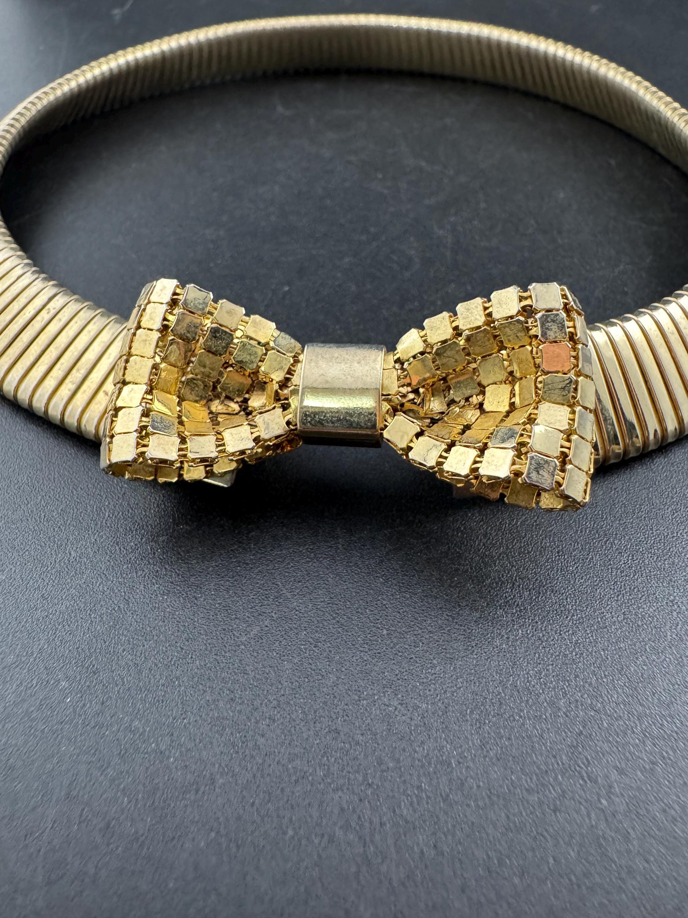 Vintage 1980s gold tone omega choker collar necklace with mesh bow detail