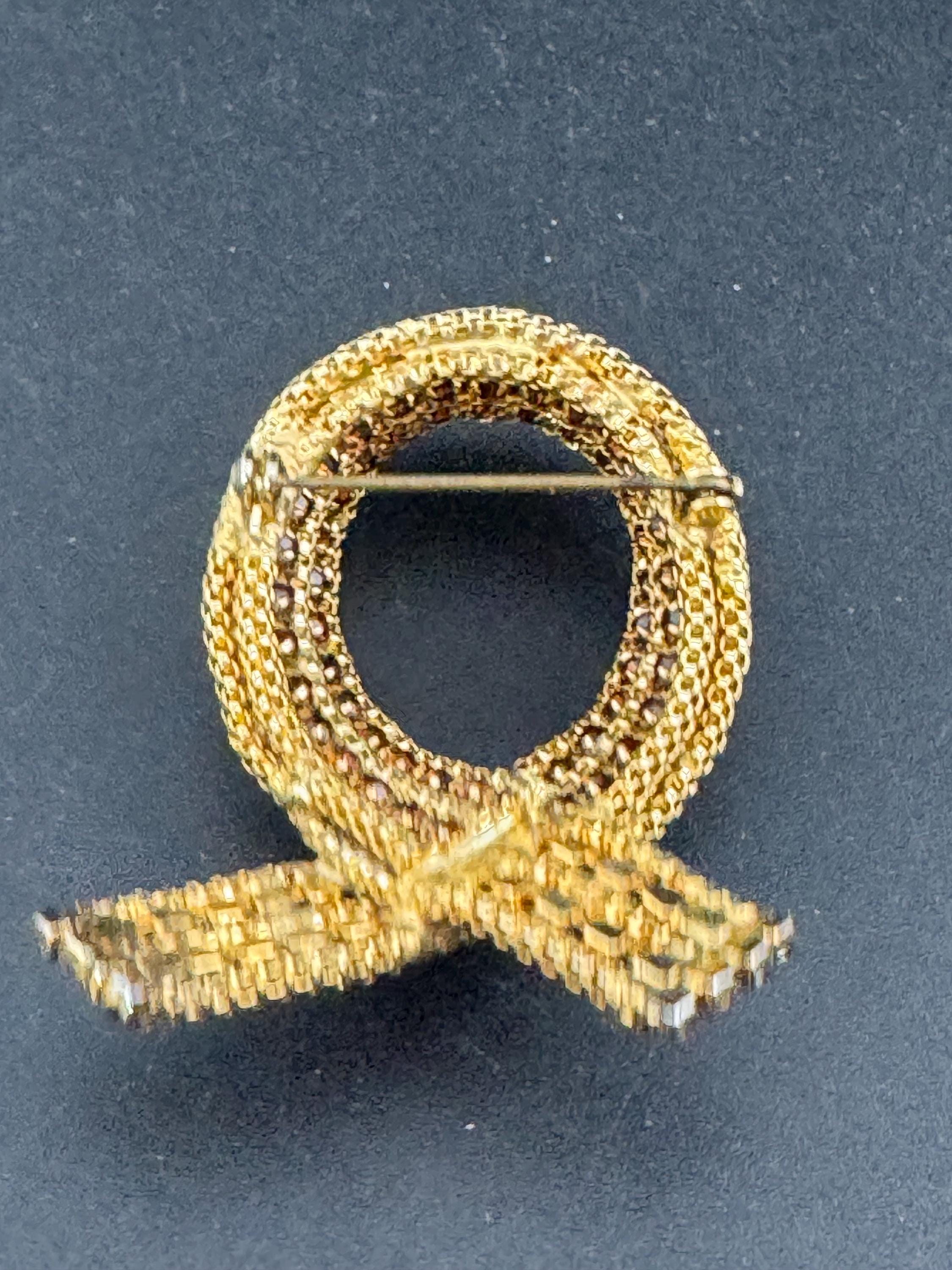 vintage gold tone mesh brown cognac glass rhinestone cross knot brooch 1960s